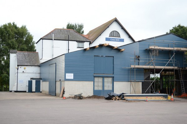 The short and tall barn, reroofed and weather-boarded. (shop front to tall barn yet to be fitted.)