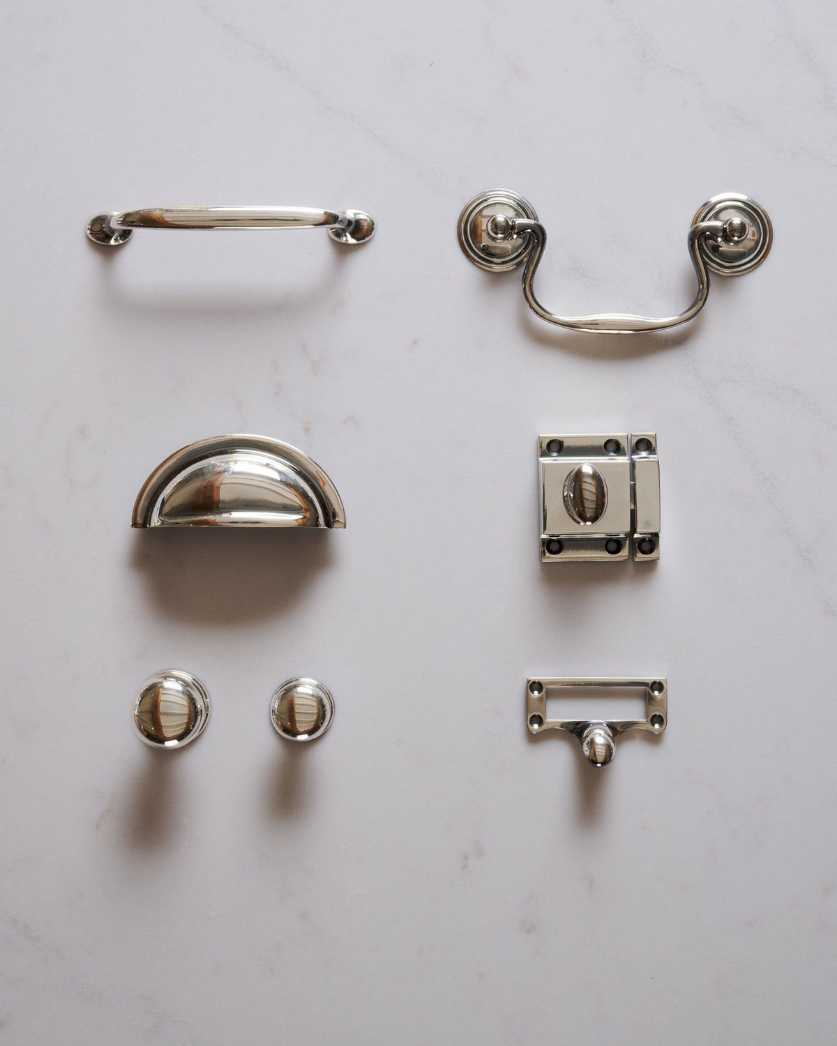 A collection of 'Bella' cupboard hardware in a tarnished silver finish. TEST
