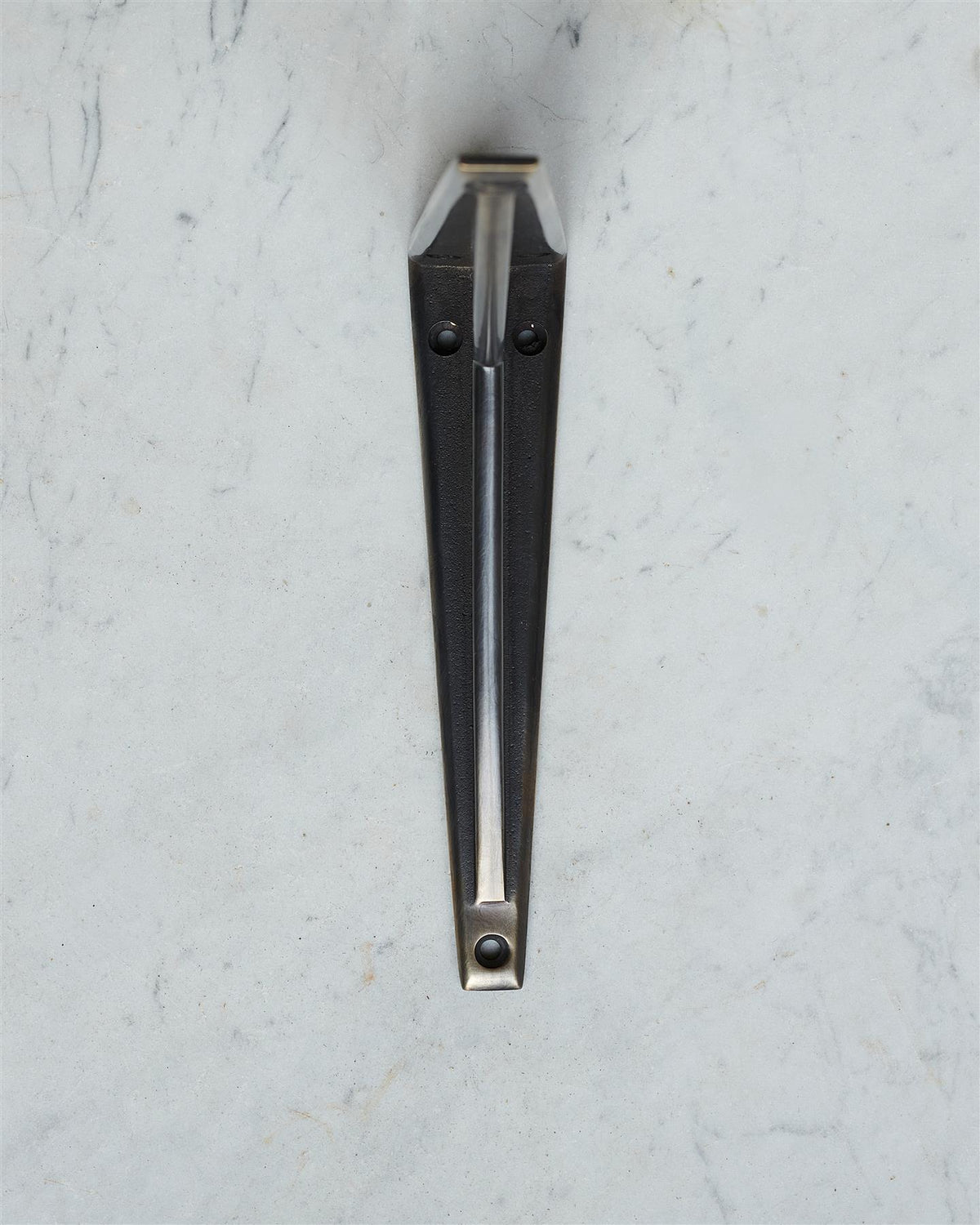 A front profile view of a classic utilitarian shelf bracket in a dark oxidised brass finish. TEST