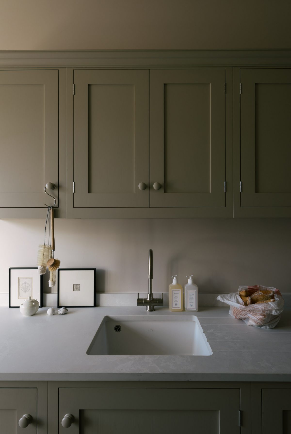 The Bath Kitchen features a manmade surface by Caesarstone, it looks pale, sleek and will take a great deal of use.