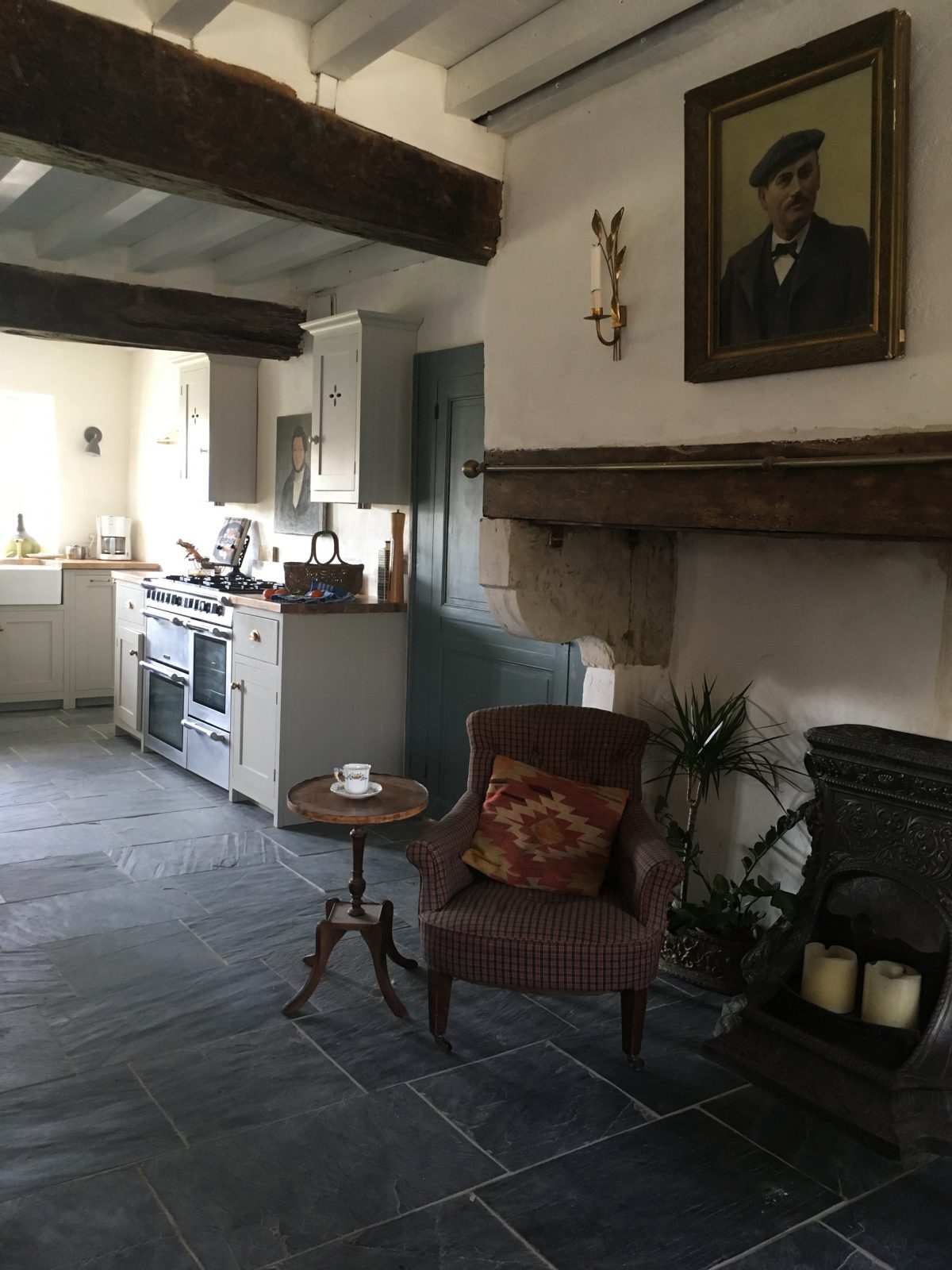 This original old fireplace is to die for, complete with a little wood burner and a couple of chairs to chill.