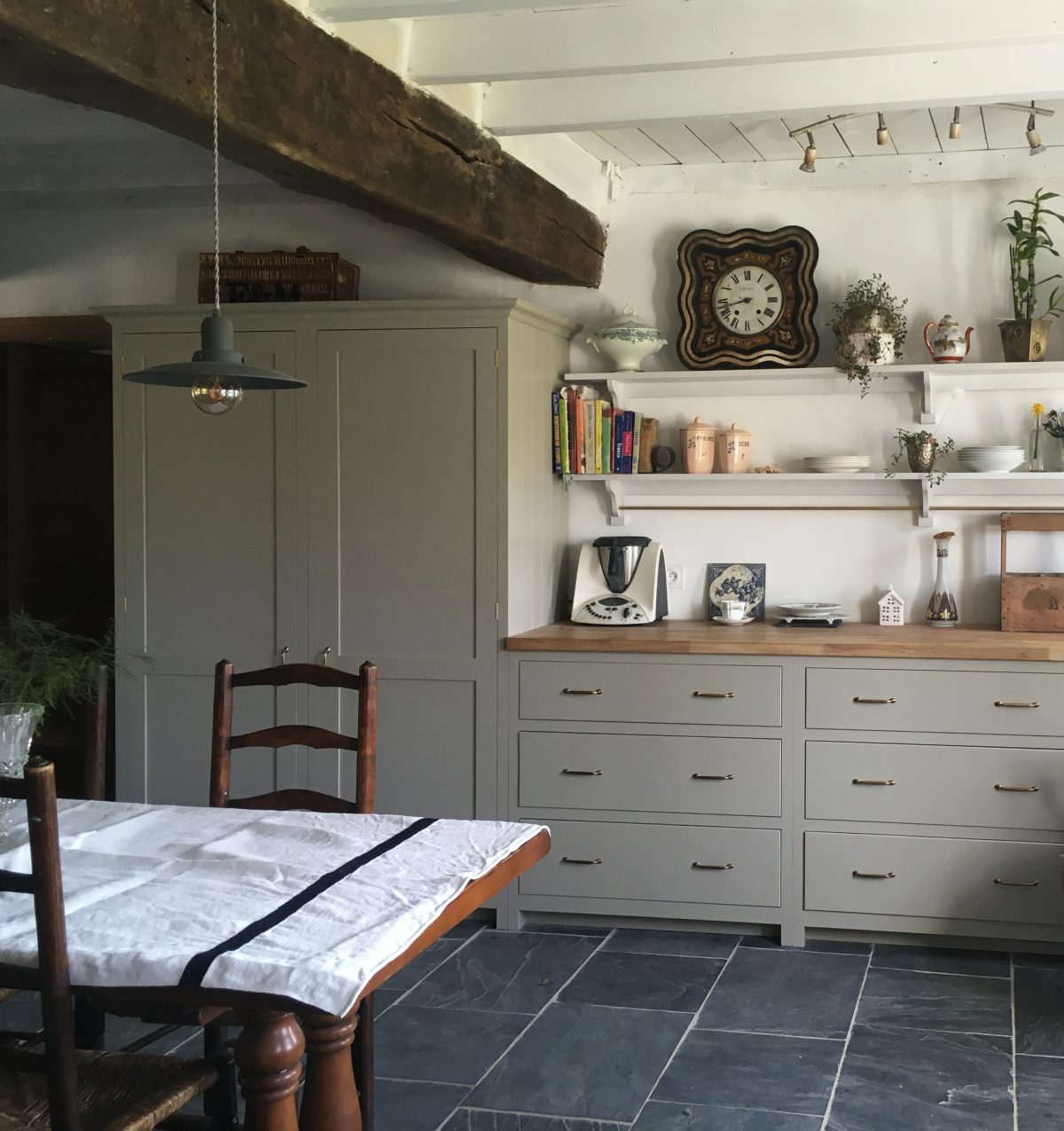 An integrated fridge freezer and big pantry are almost undetectable behind hand-painted Shaker doors.