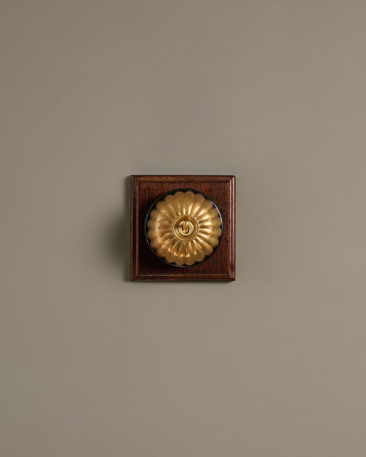 The Jelly Toggle Switch (1 Gang & Mahogany Finish Pattress) - Aged Brass with Black Base. TEST