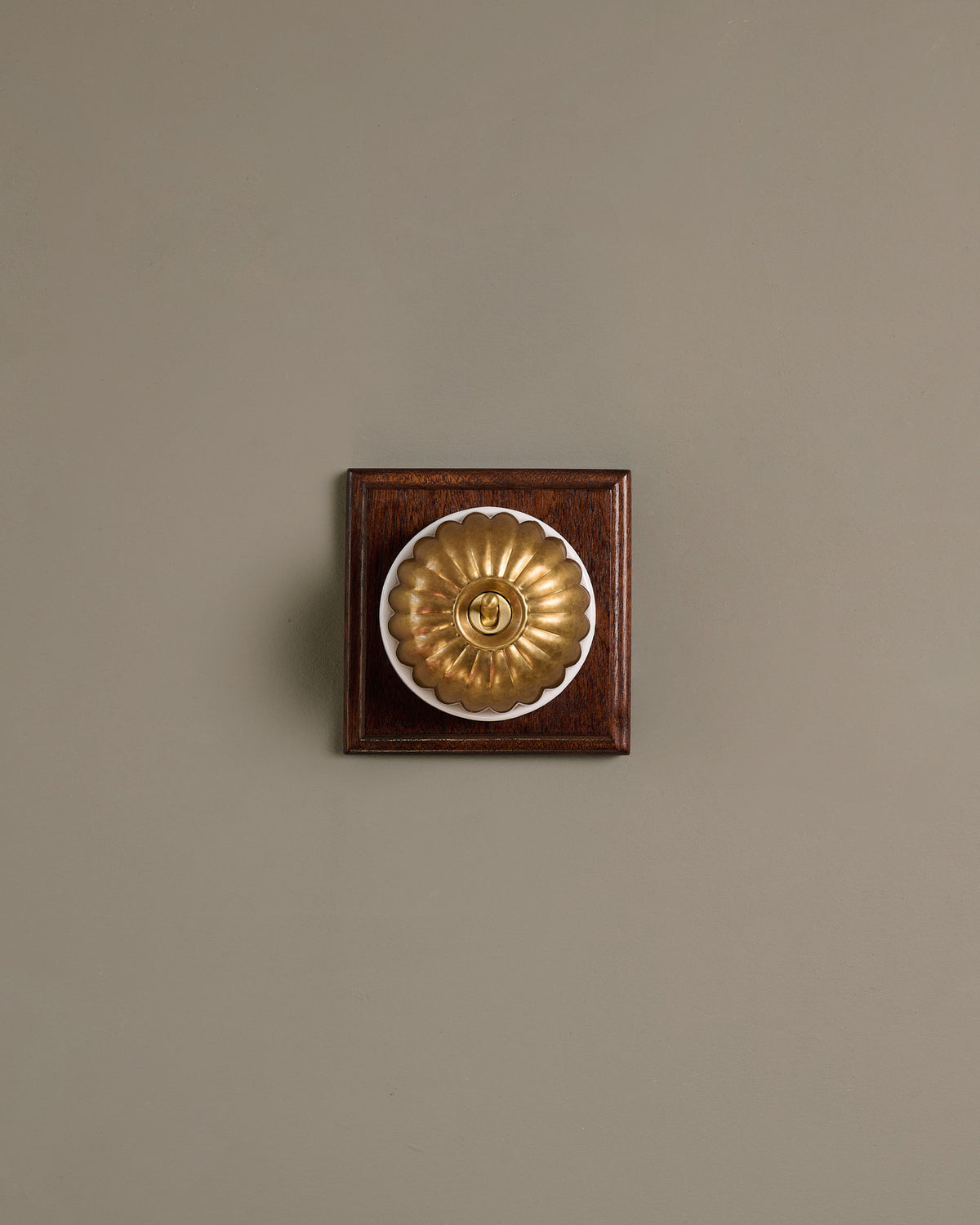 The Jelly Toggle Switch (1 Gang & Mahogany Finish Pattress) - Aged Brass with White Base. TEST