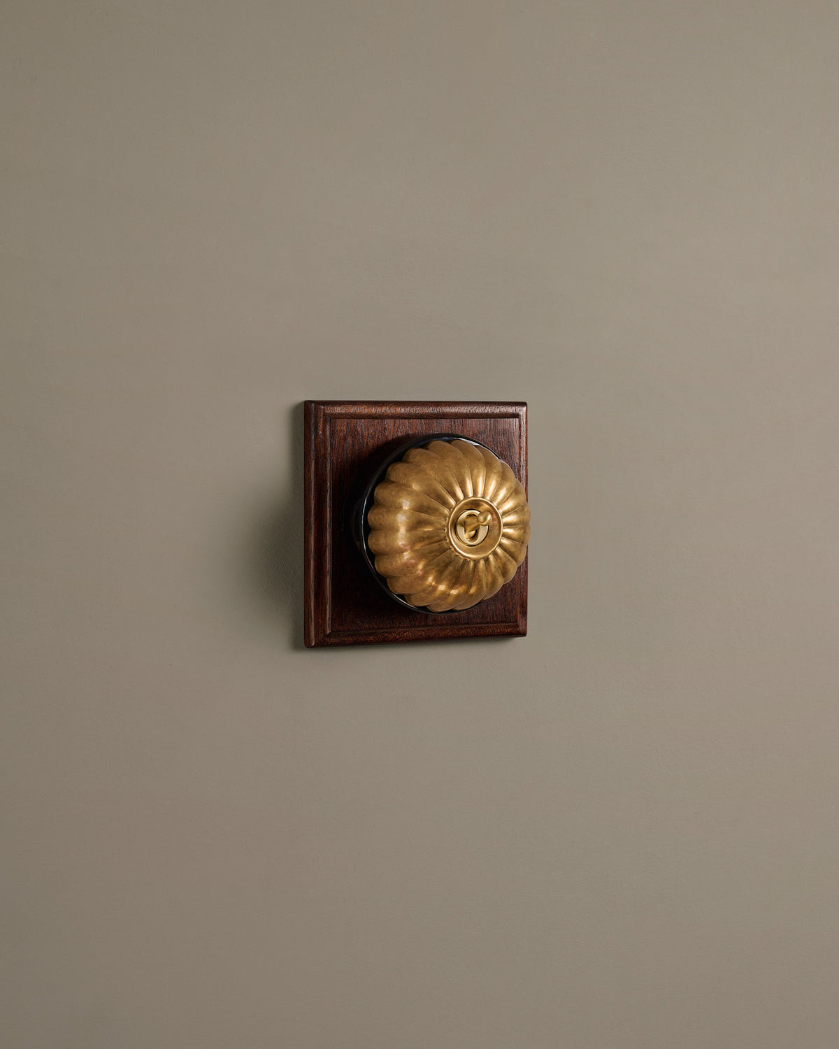 The Jelly Toggle Switch (1 Gang & Mahogany Finish Pattress) - Aged Brass with Black Base. TEST