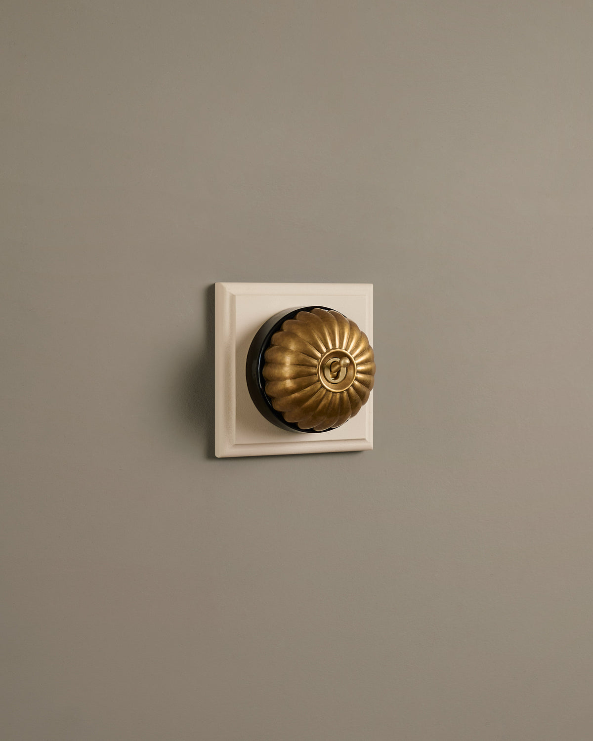 The Jelly Toggle Switch (1 Gang & Primed Maple Pattress) - Aged Brass with Black Base. TEST