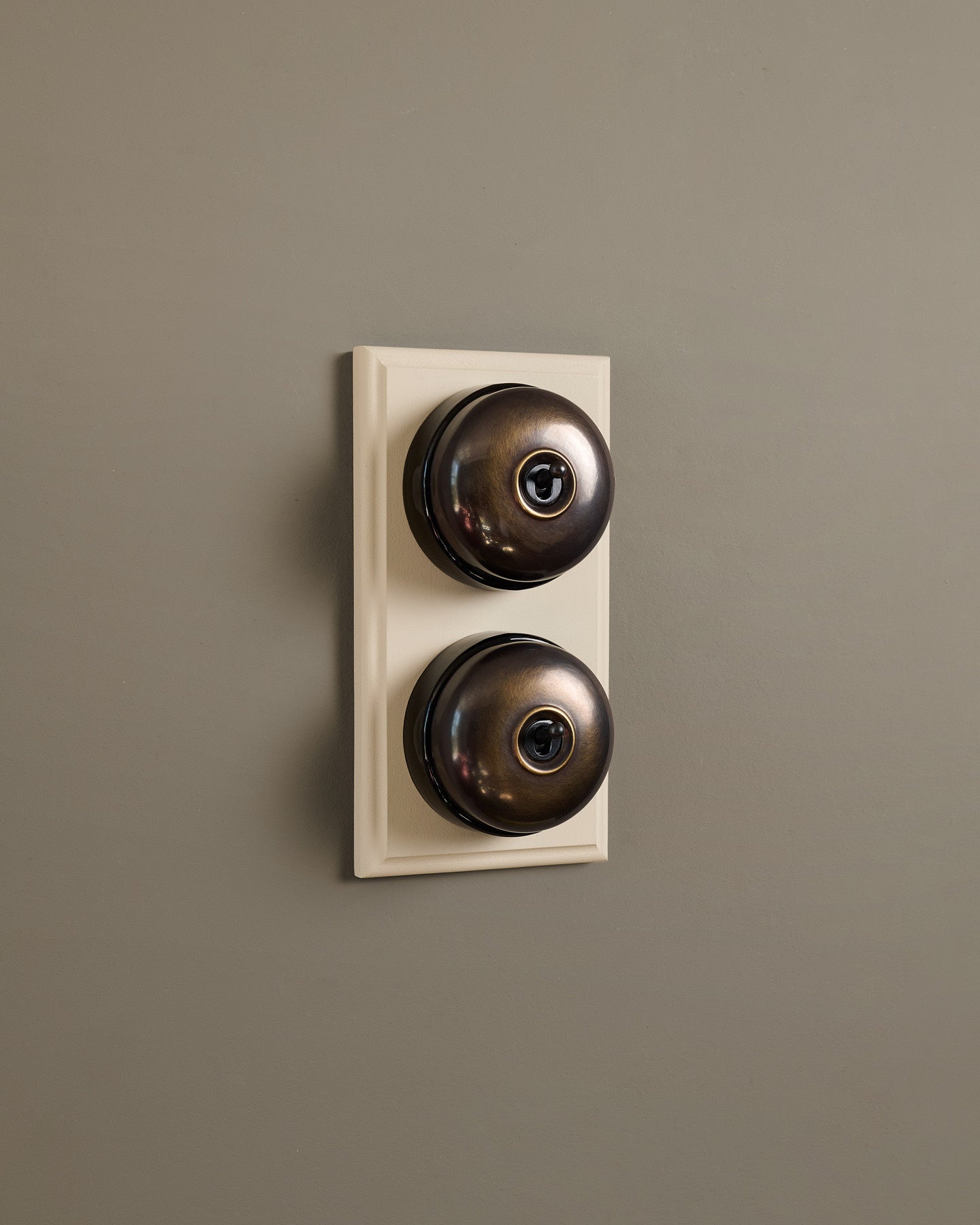 The Dolly Toggle Switch (2 Gang & Primed Maple Pattress) - Oxidised Brass with Black Base.