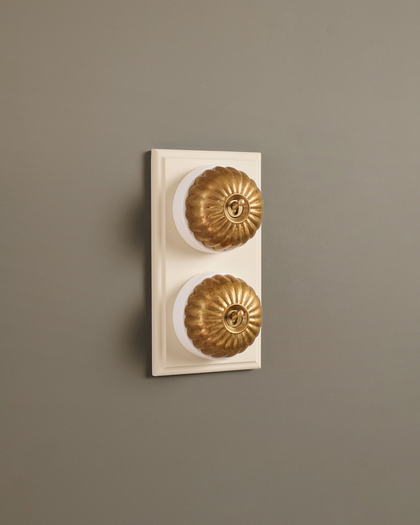 The Jelly Toggle Switch (2 Gang & Primed Maple Pattress) - Aged Brass with White Base.