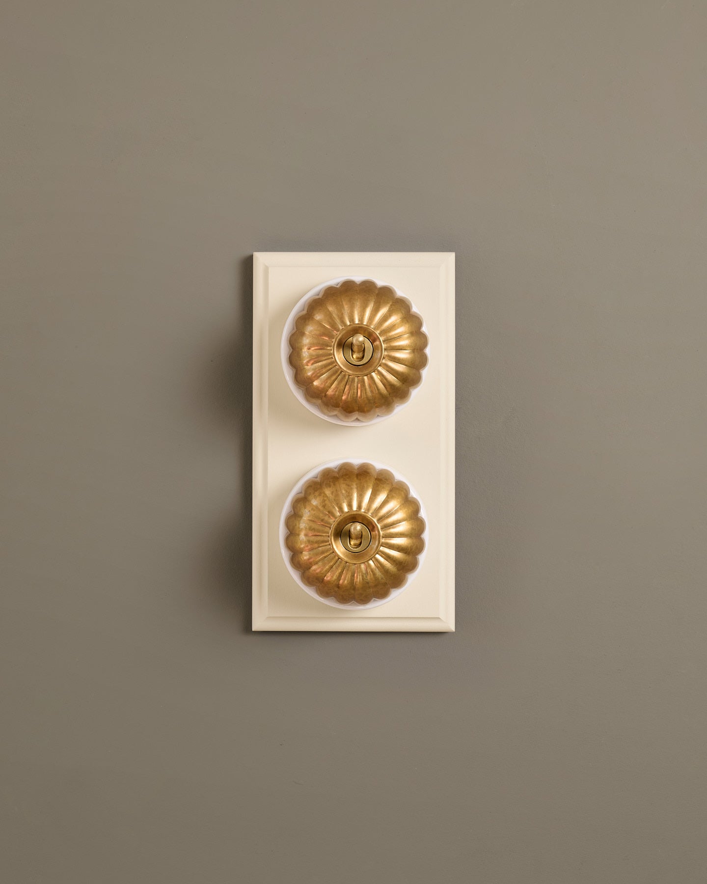 The Jelly Toggle Switch (2 Gang & Primed Maple Pattress) - Aged Brass with White Base.