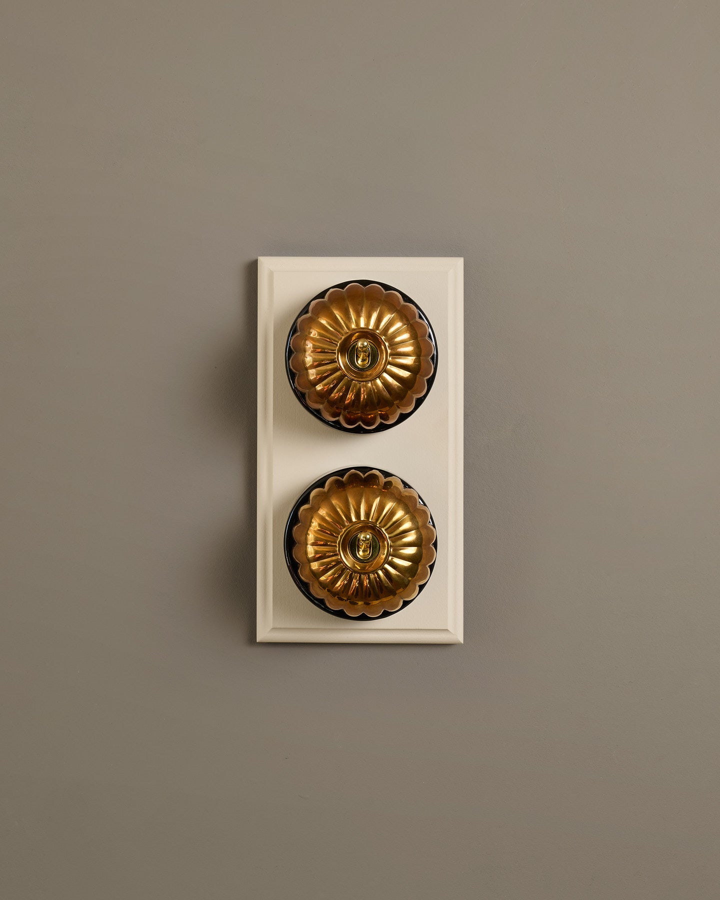 The Jelly Toggle Switch (2 Gang & Primed Maple Pattress) - Heirloom Brass with Black Base.