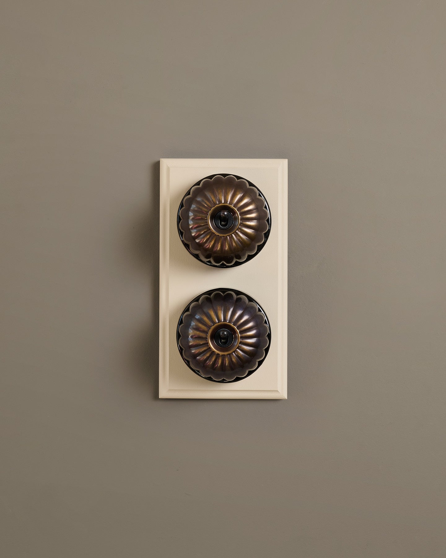 The Jelly Toggle Switch (2 Gang & Primed Maple Pattress) - Oxidised Brass with Black Base.