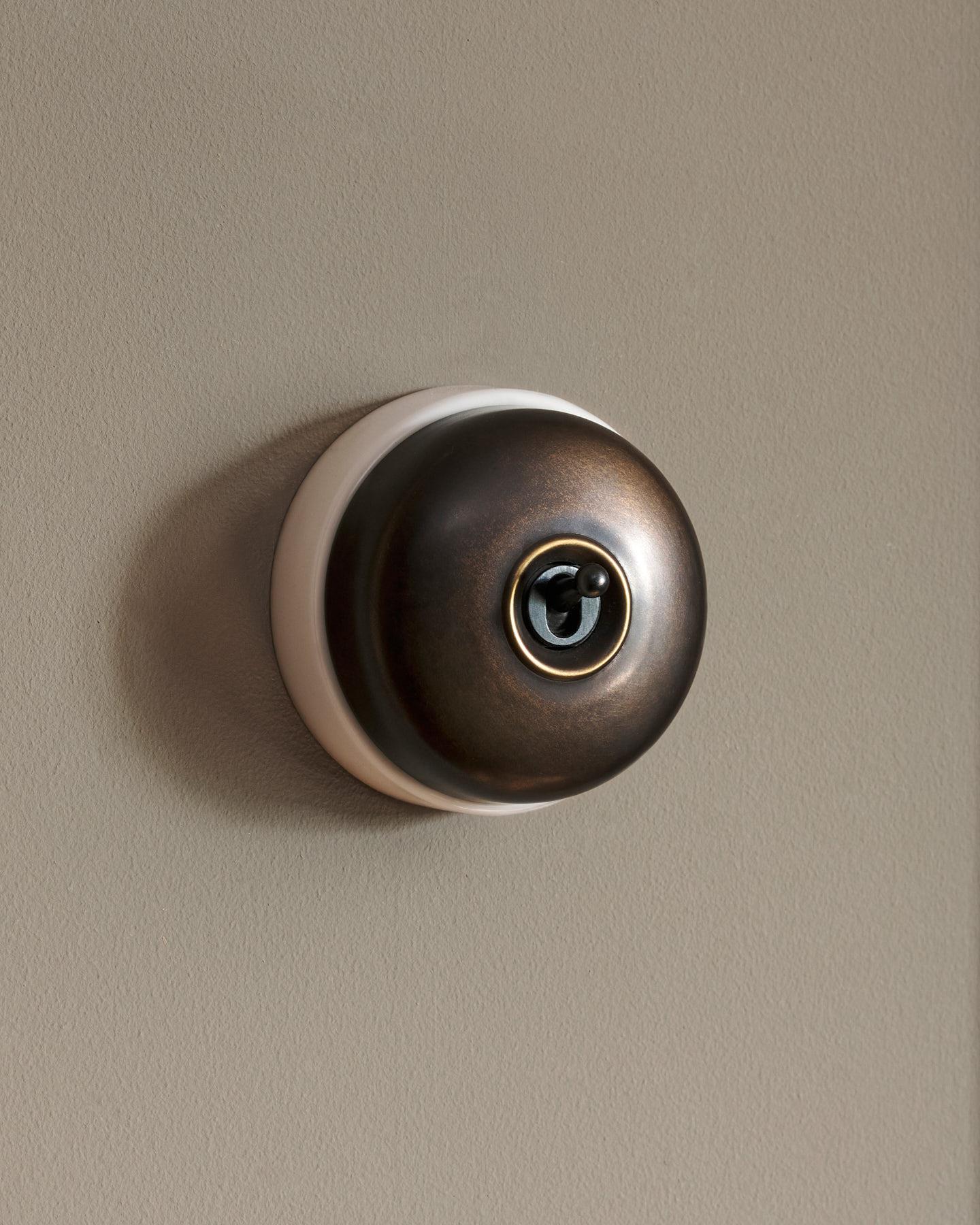 The Dolly Toggle Switch - Oxidised Brass, White Base, Intermediate