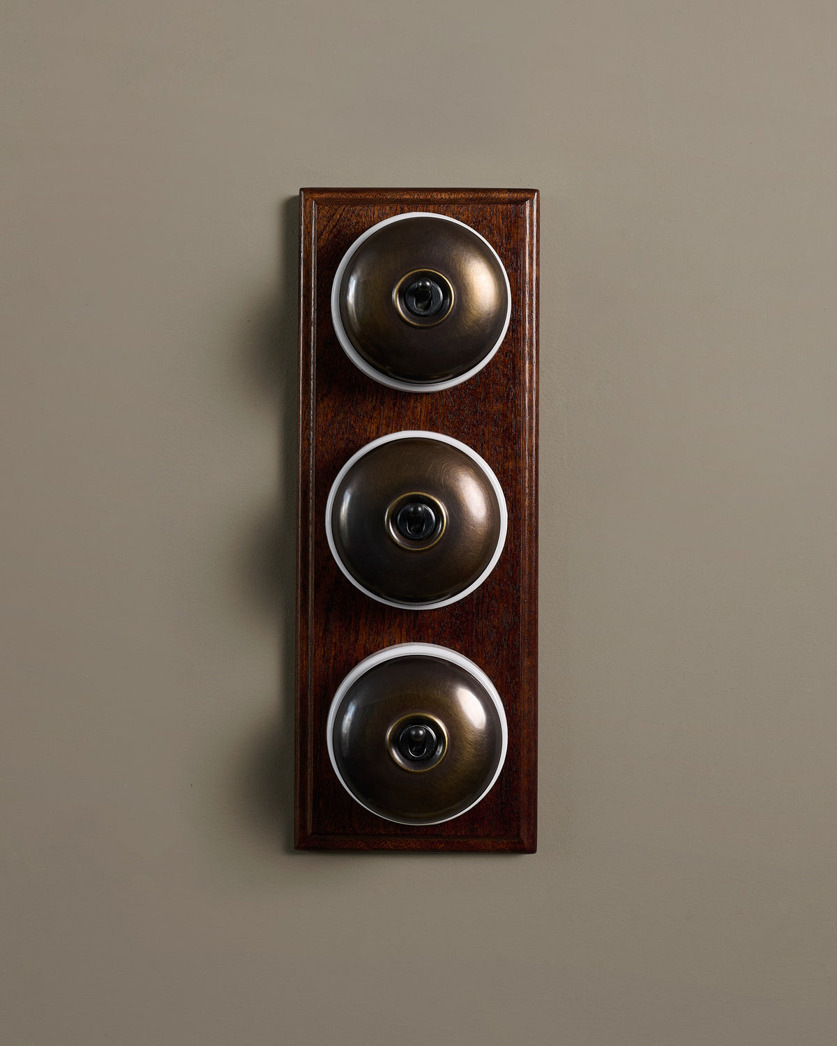 The Dolly Toggle Switch (3 Gang & Mahogany Finish Pattress) - Oxidised Brass with White Base. TEST