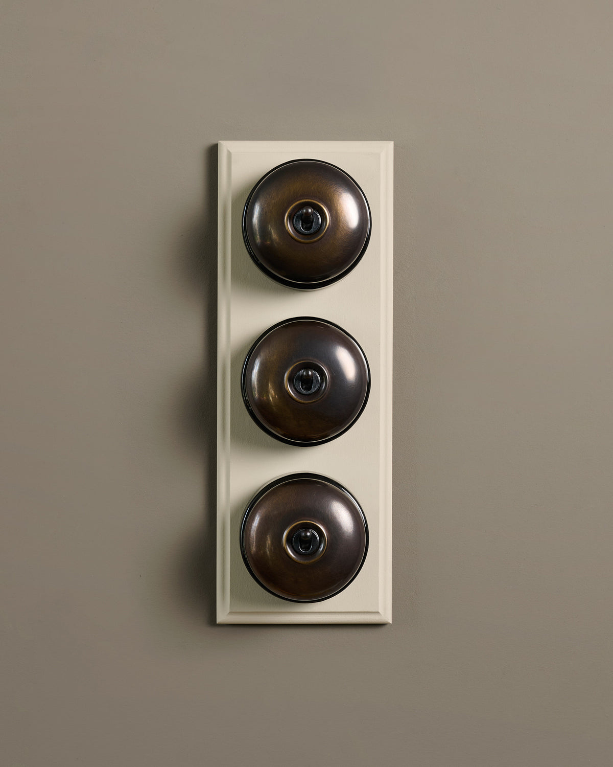 The Dolly Toggle Switch (3 Gang & Primed Maple Pattress) - Oxidised Brass with Black Base. TEST