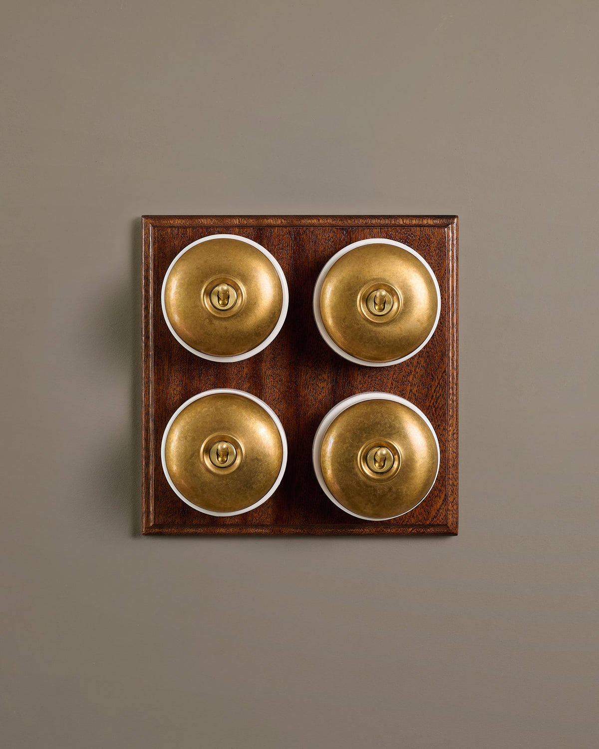The Dolly Toggle Switch (4 Gang Bank & Mahogany Finish Pattress) - Aged Brass with White Base. TEST