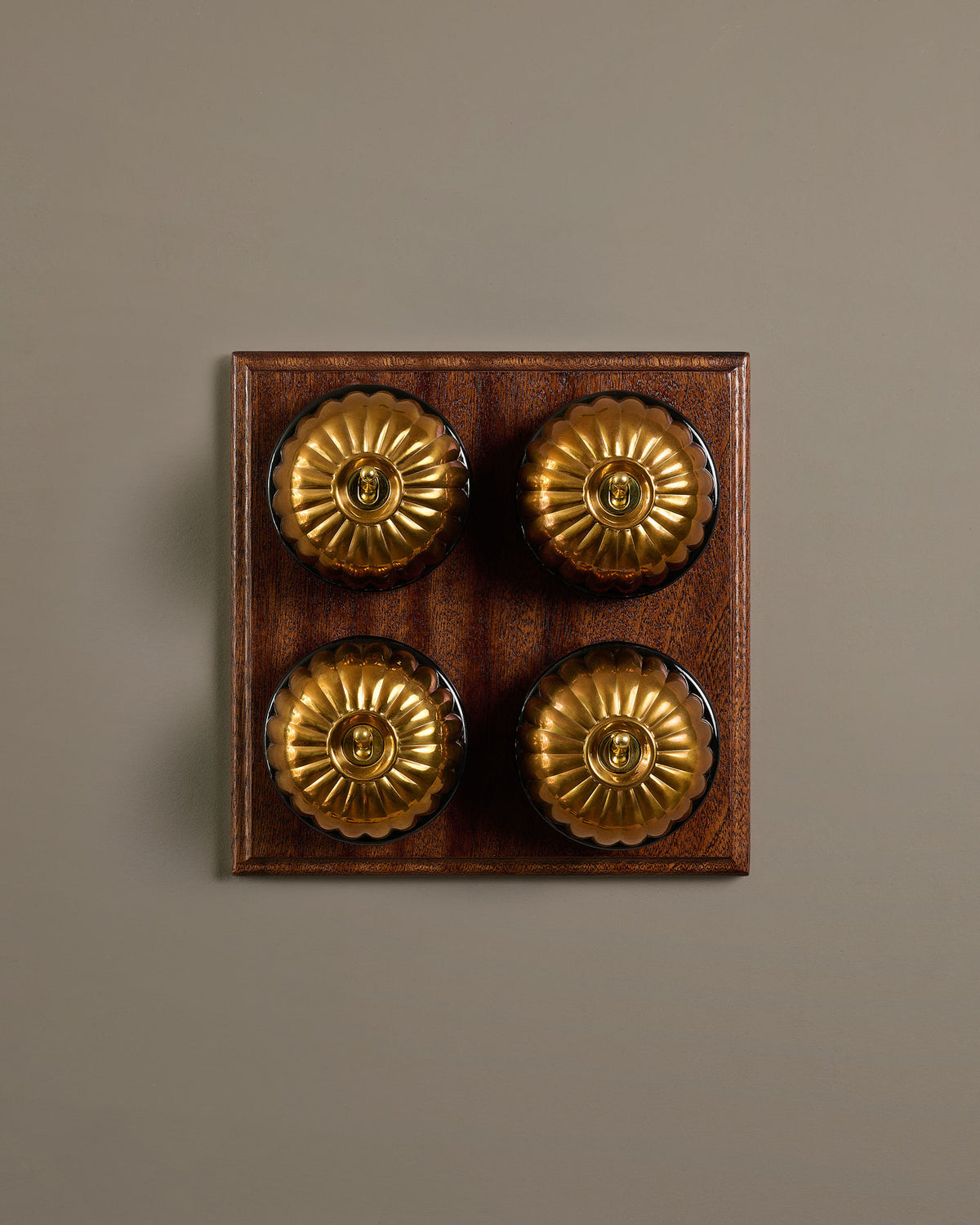 The Jelly Toggle Switch (4 Gang Bank & Mahogany Finish Pattress) - Heirloom Brass with Black Base. TEST
