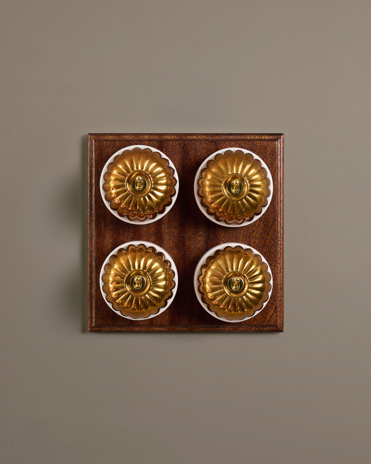 The Jelly Toggle Switch (4 Gang Bank & Mahogany Finish Pattress) - Heirloom Brass with White Base. TEST