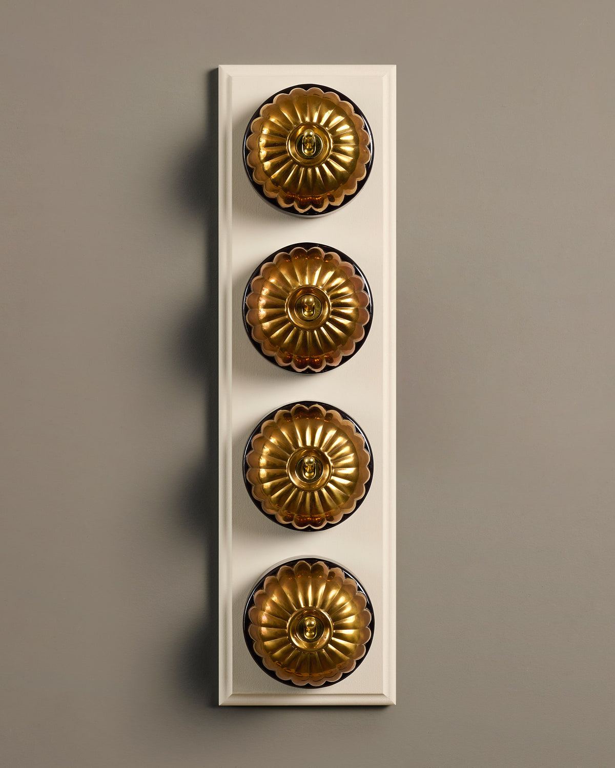 The Jelly Toggle Switch (4 Gang Row & Primed Maple Pattress) - Heirloom Brass with Black Base. TEST