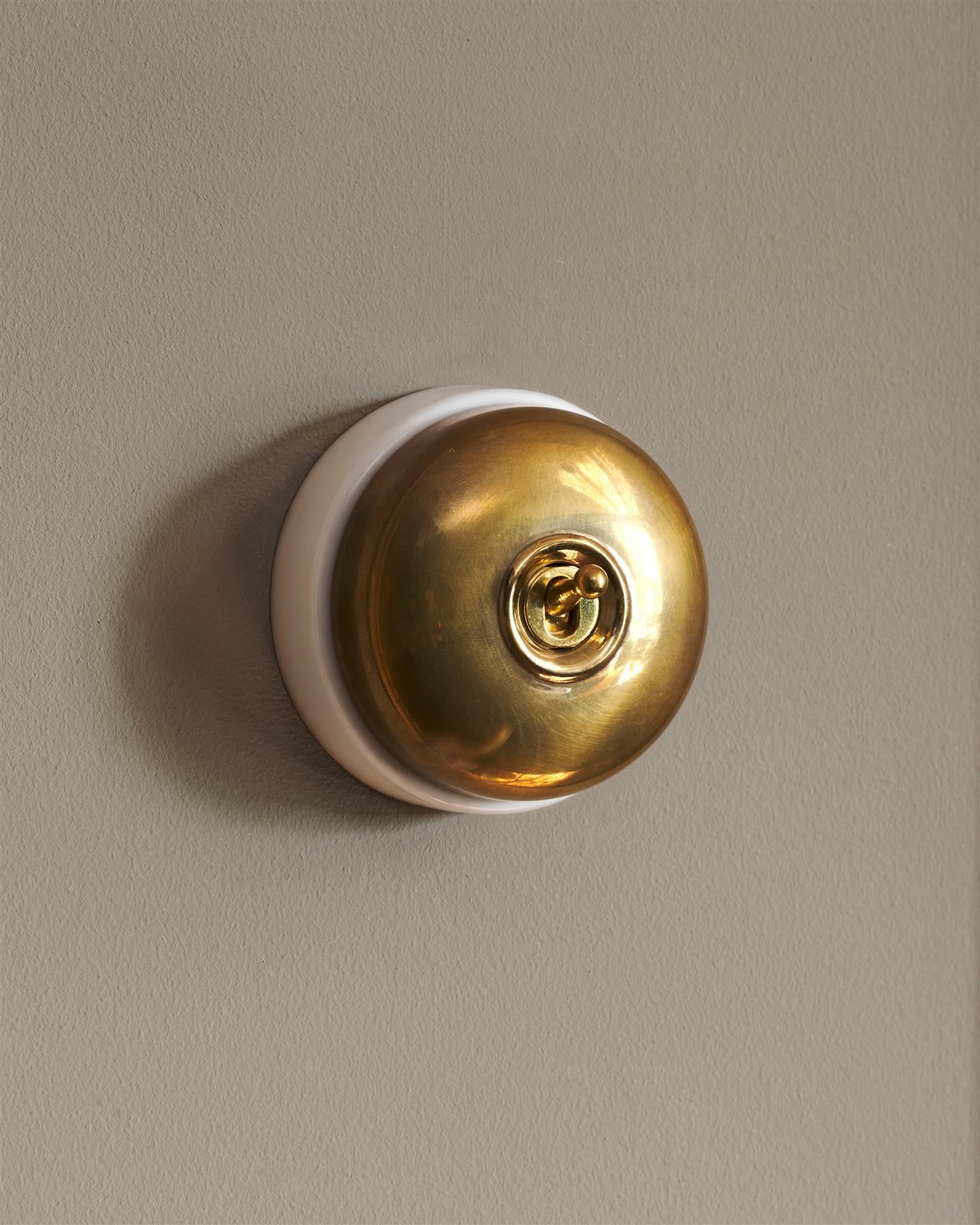 The Dolly Toggle Switch - Heirloom Brass, White Base, Intermediate