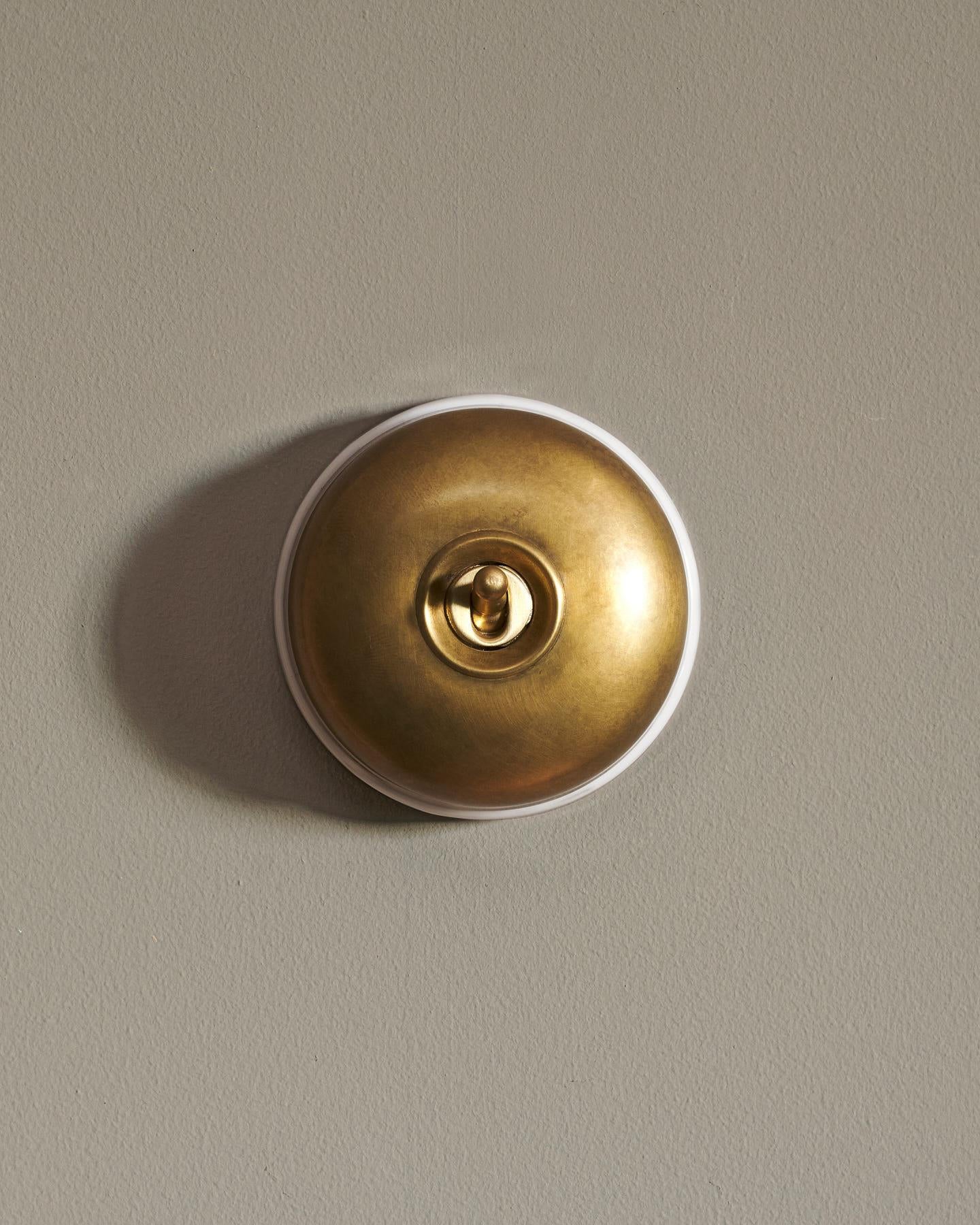 The Dolly Toggle Switch - Aged Brass, White Base, Intermediate