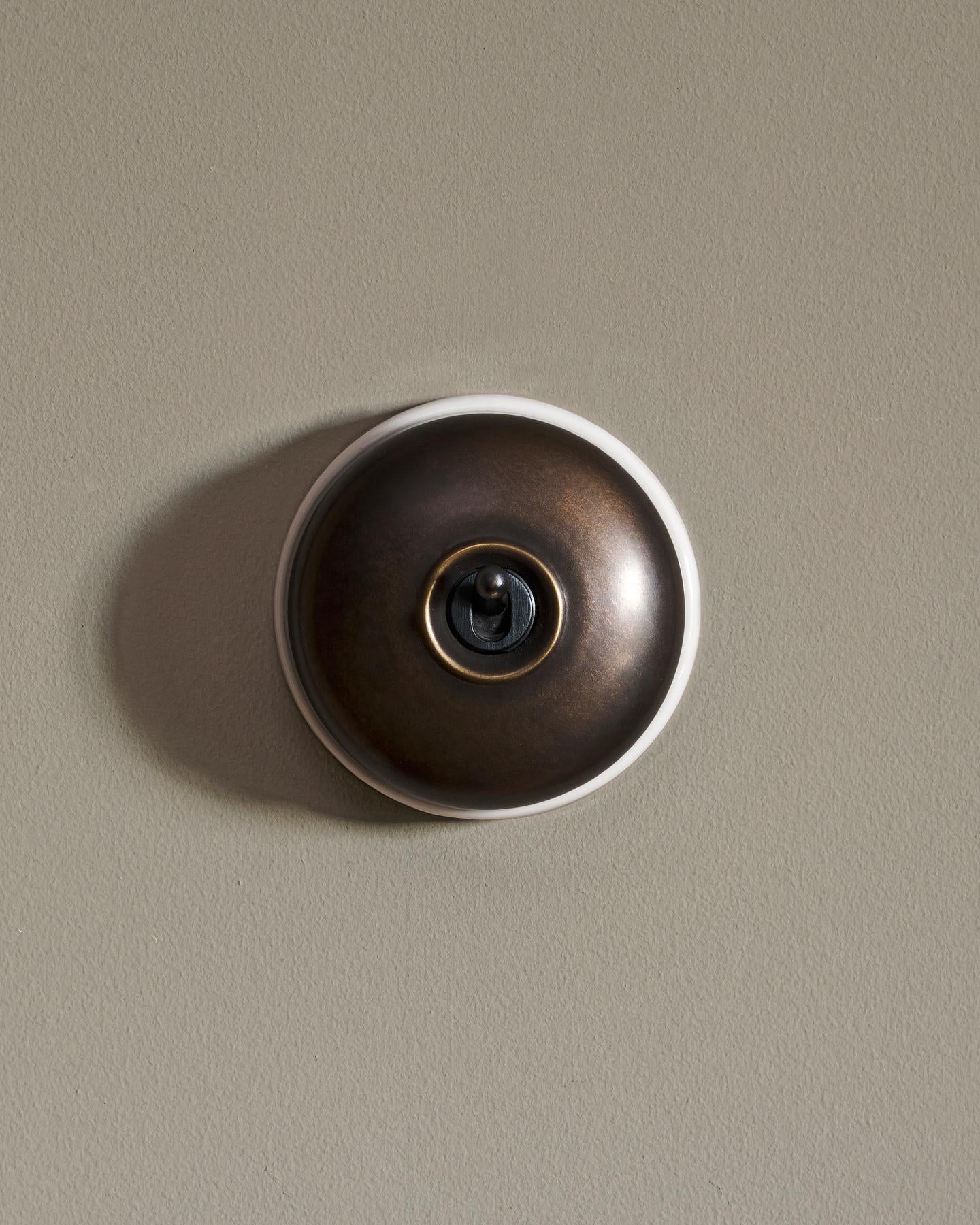 The Dolly Toggle Switch - Oxidised Brass, White Base, Intermediate