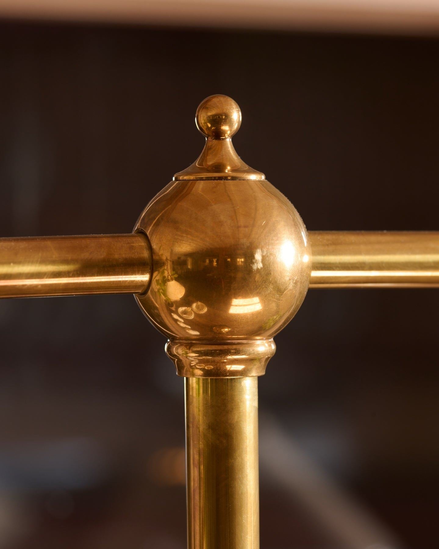 A close-up view of a pointed brass finial.