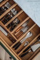 A closer look at the bespoke drawers with built-in dividers for utensils.