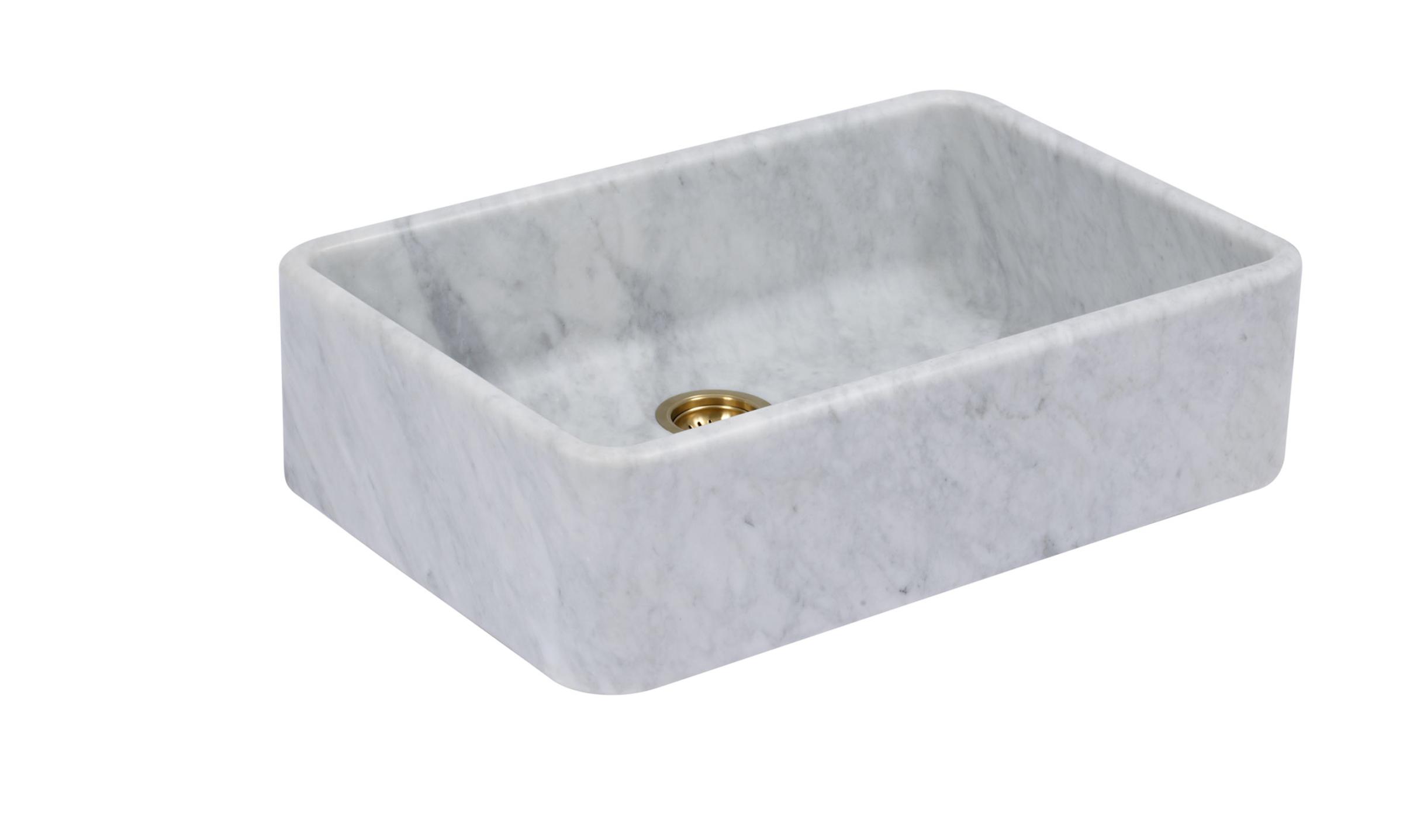A cut-out image of a honed marble sink with soft and subtle grey veining.