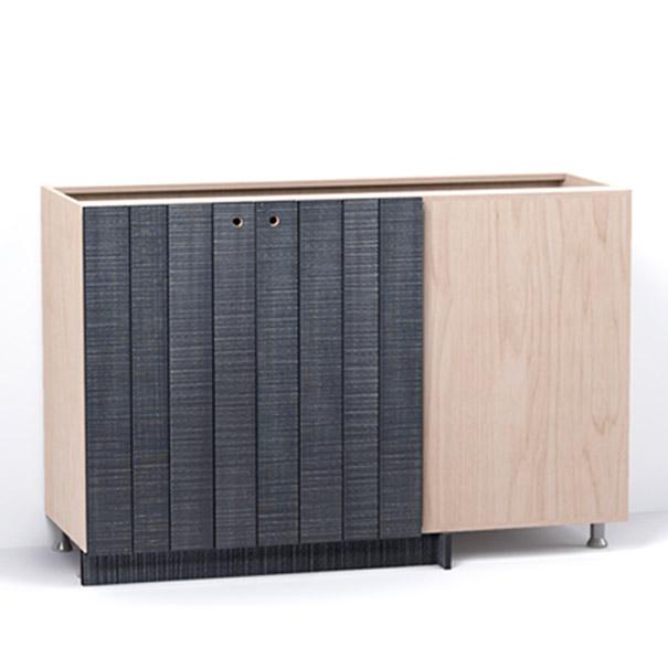 A render of a blind corner cabinet from deVOL's Sebastian Cox range, with double doors made from individual planks and finished with an inky-blue stain and band-sawn texture.
