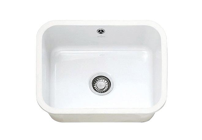 A cut-out image of a traditional white ceramic sink, suitable for undermount sink cabinets.