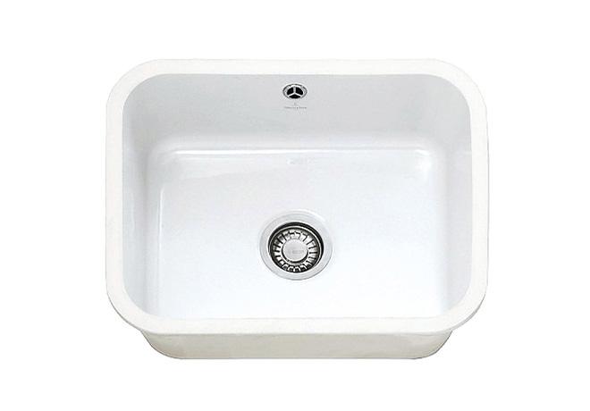 A cut-out image of a traditional white ceramic sink, suitable for undermount sink cabinets.