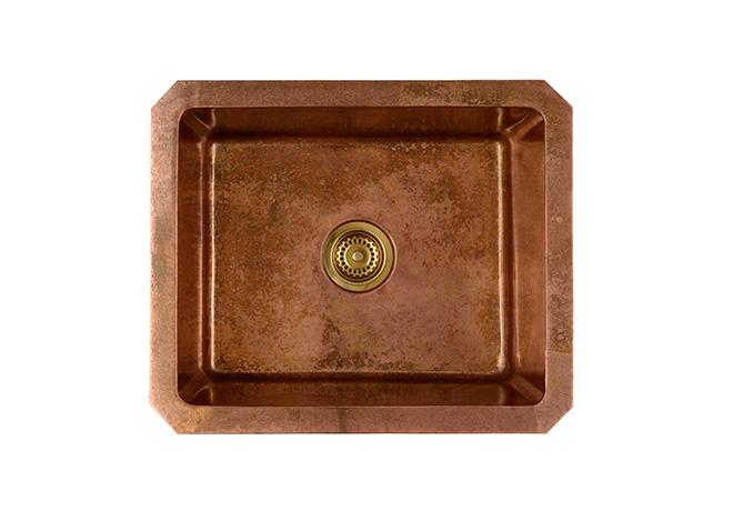 A cut-out image of an aged copper single sink.