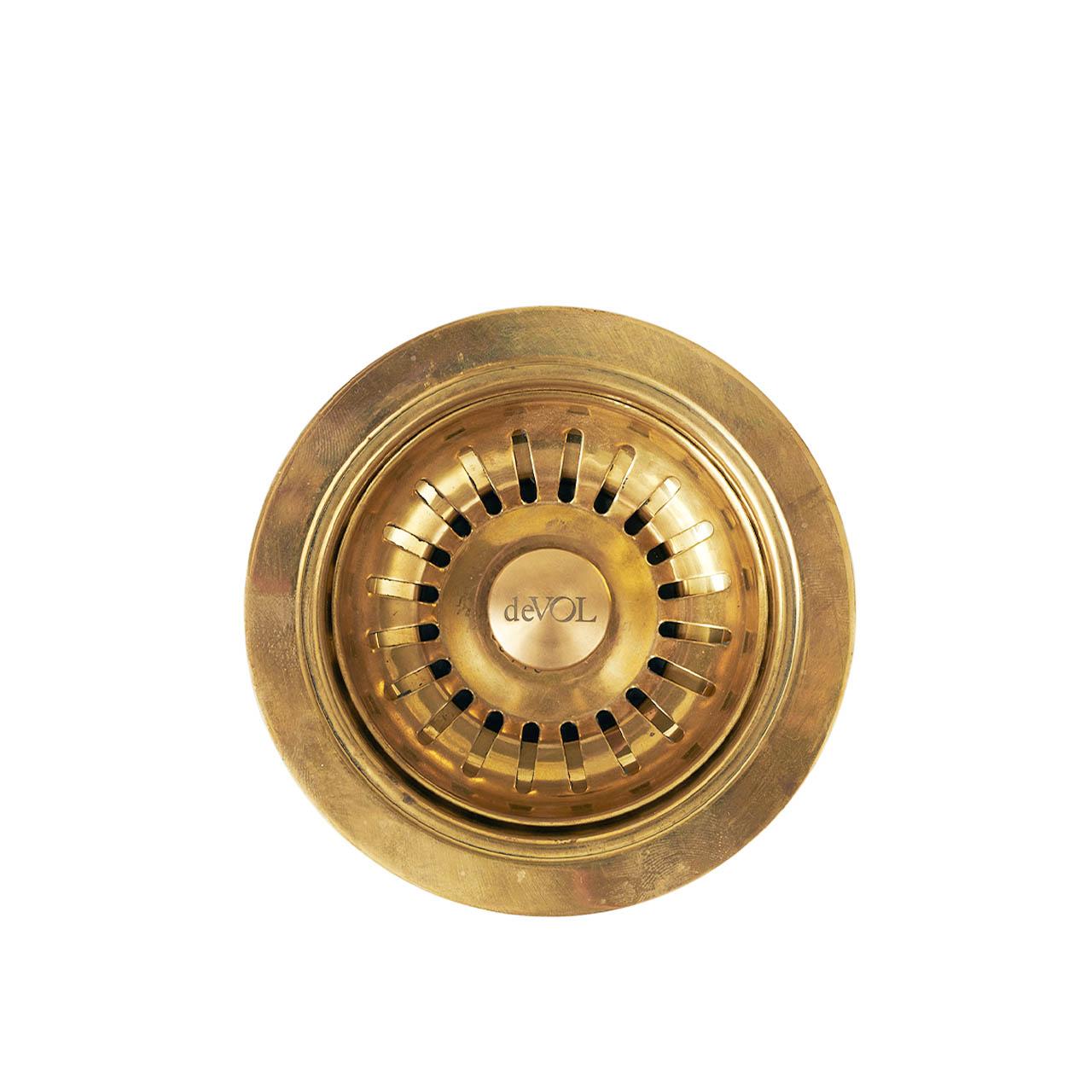 A cut-out image of a traditional style sink waste strainer and overflow kit in our aged brass finish.