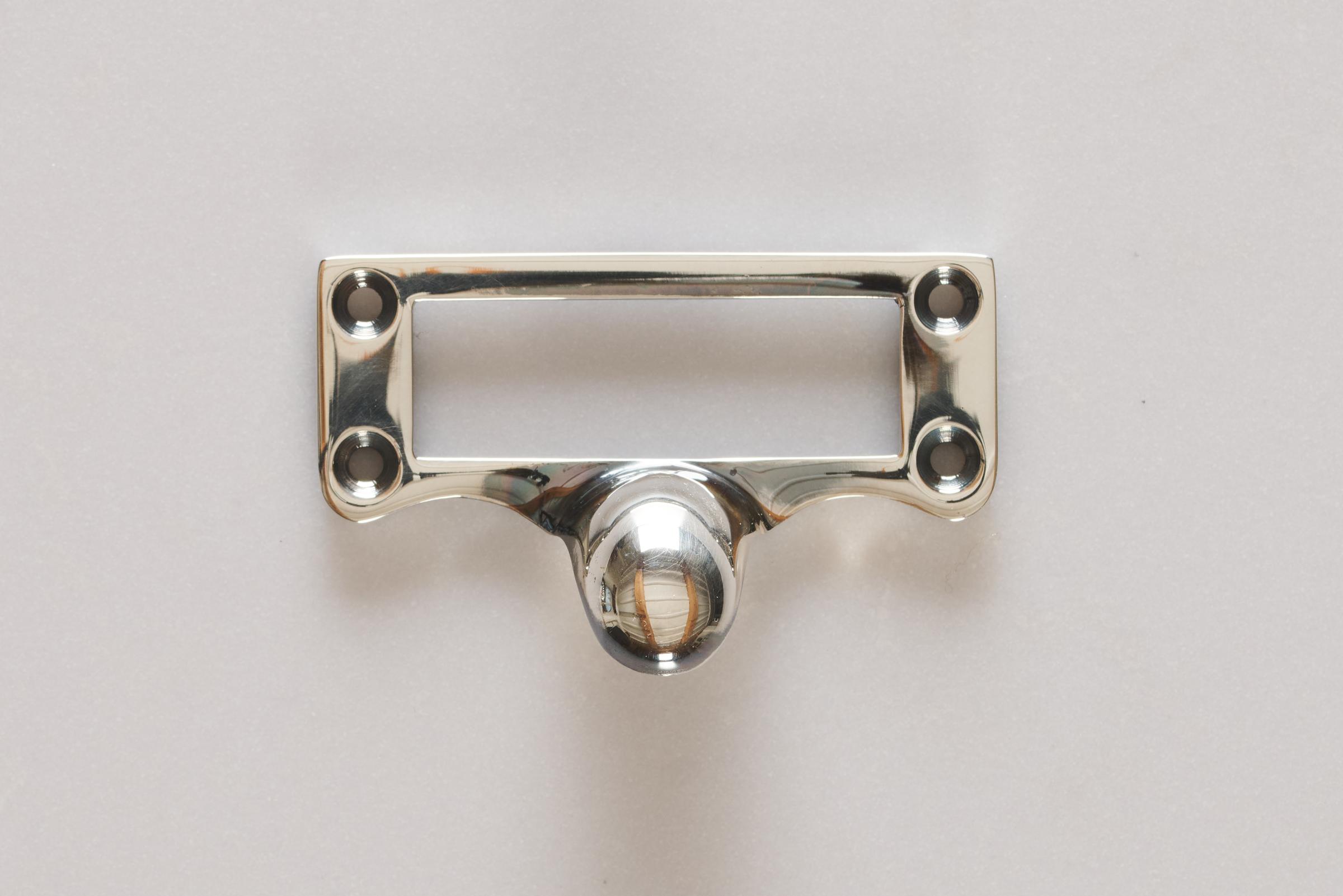 A small cardframe pull handle in a tarnished 'Bella' silver finish.