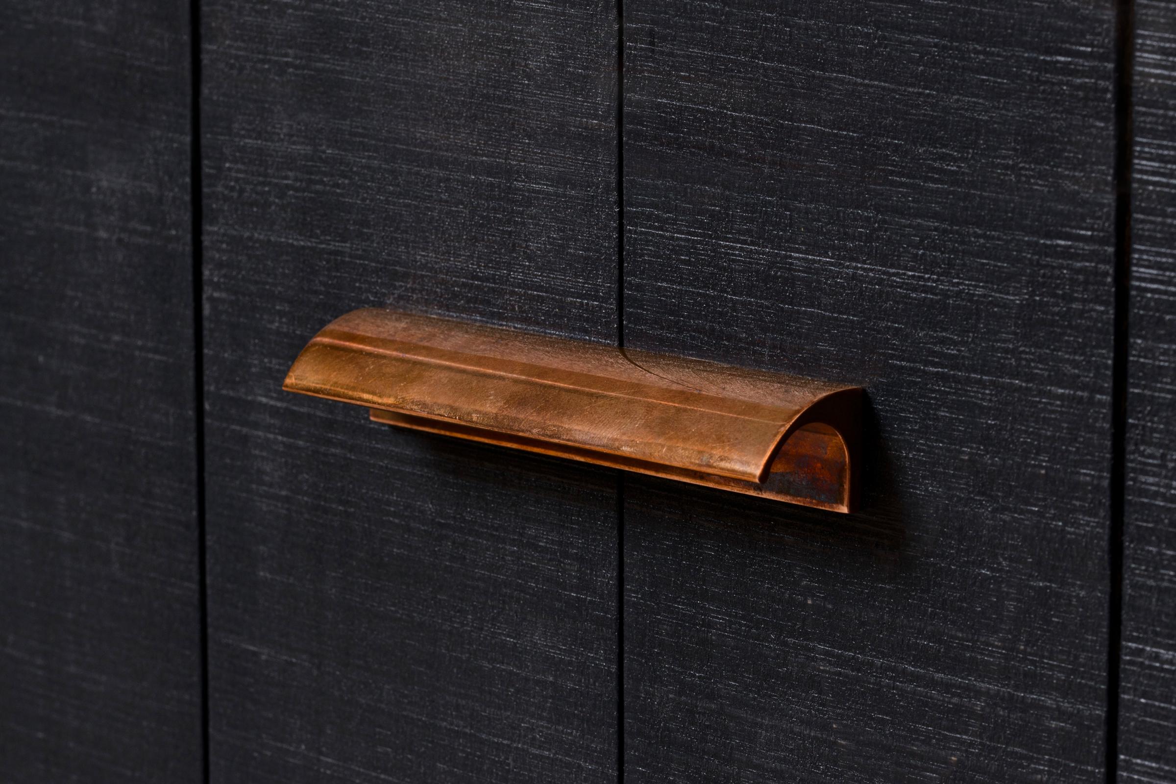 An aged copper pull handle from deVOL's Sebastian Cox range.