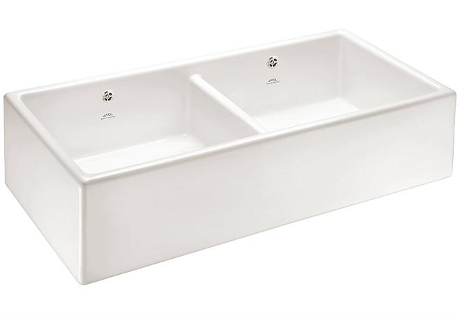 A cut-out image of a traditional white ceramic Belfast sink with two basins.