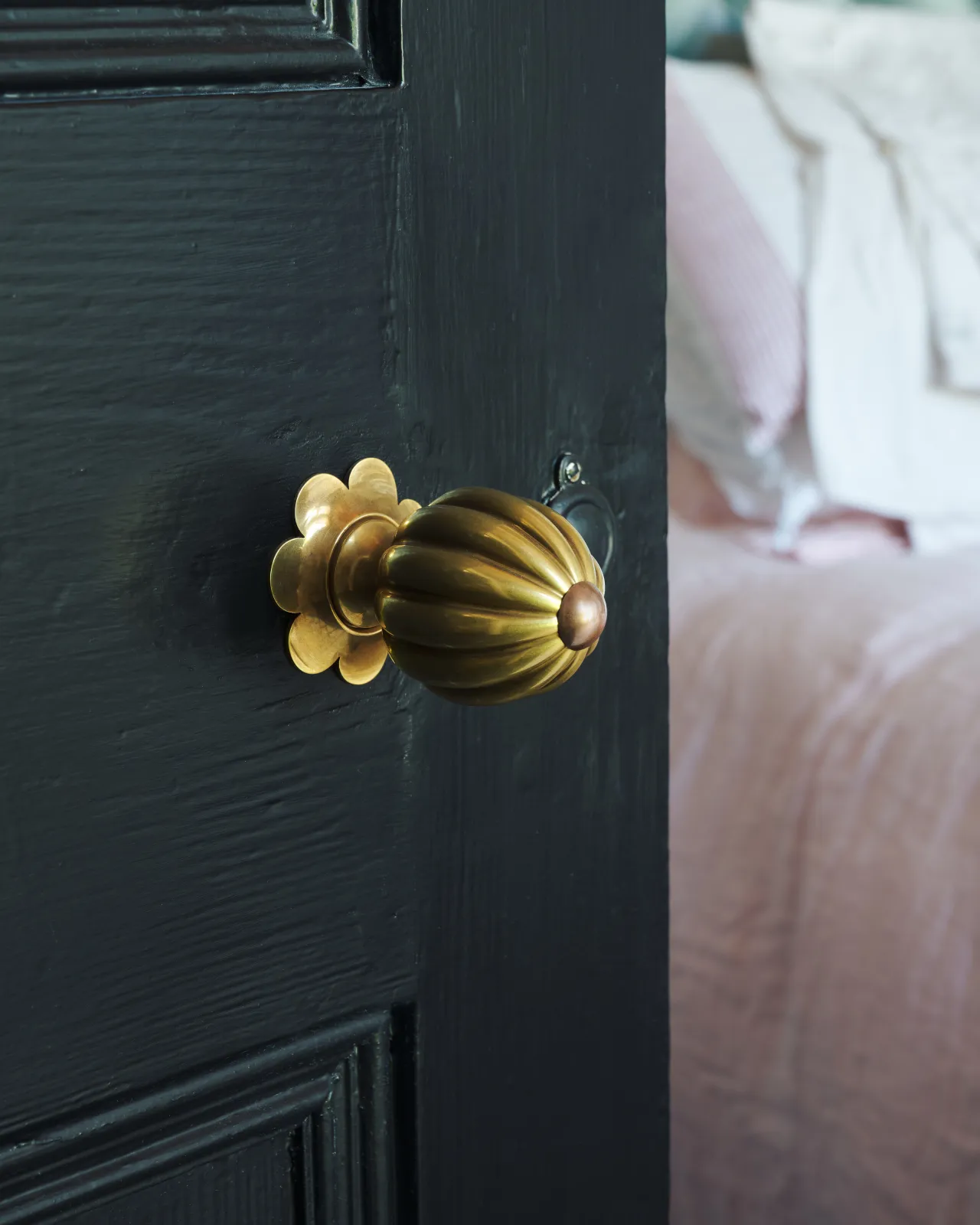 Marguerite Doorknob on a black door.