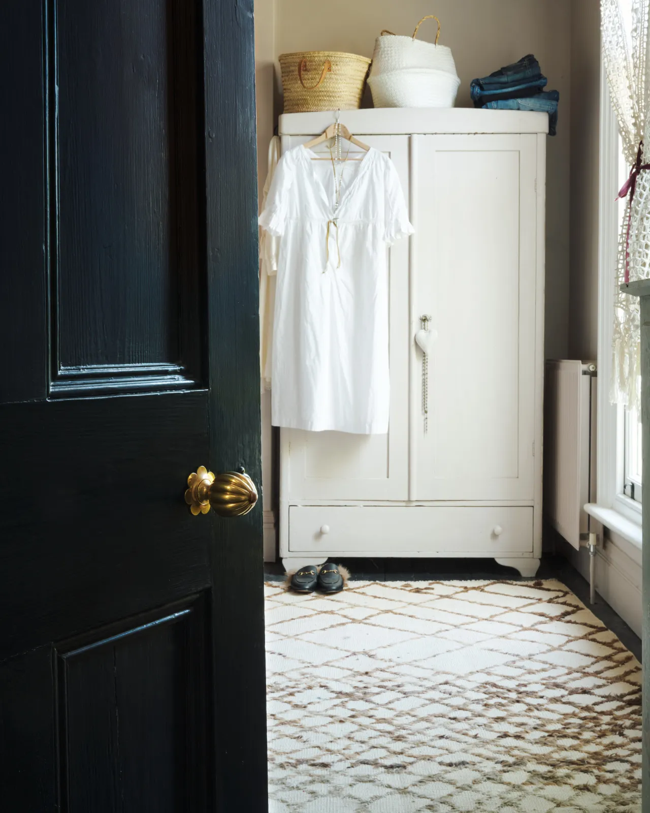 Marguerite Doorknob on a black door.