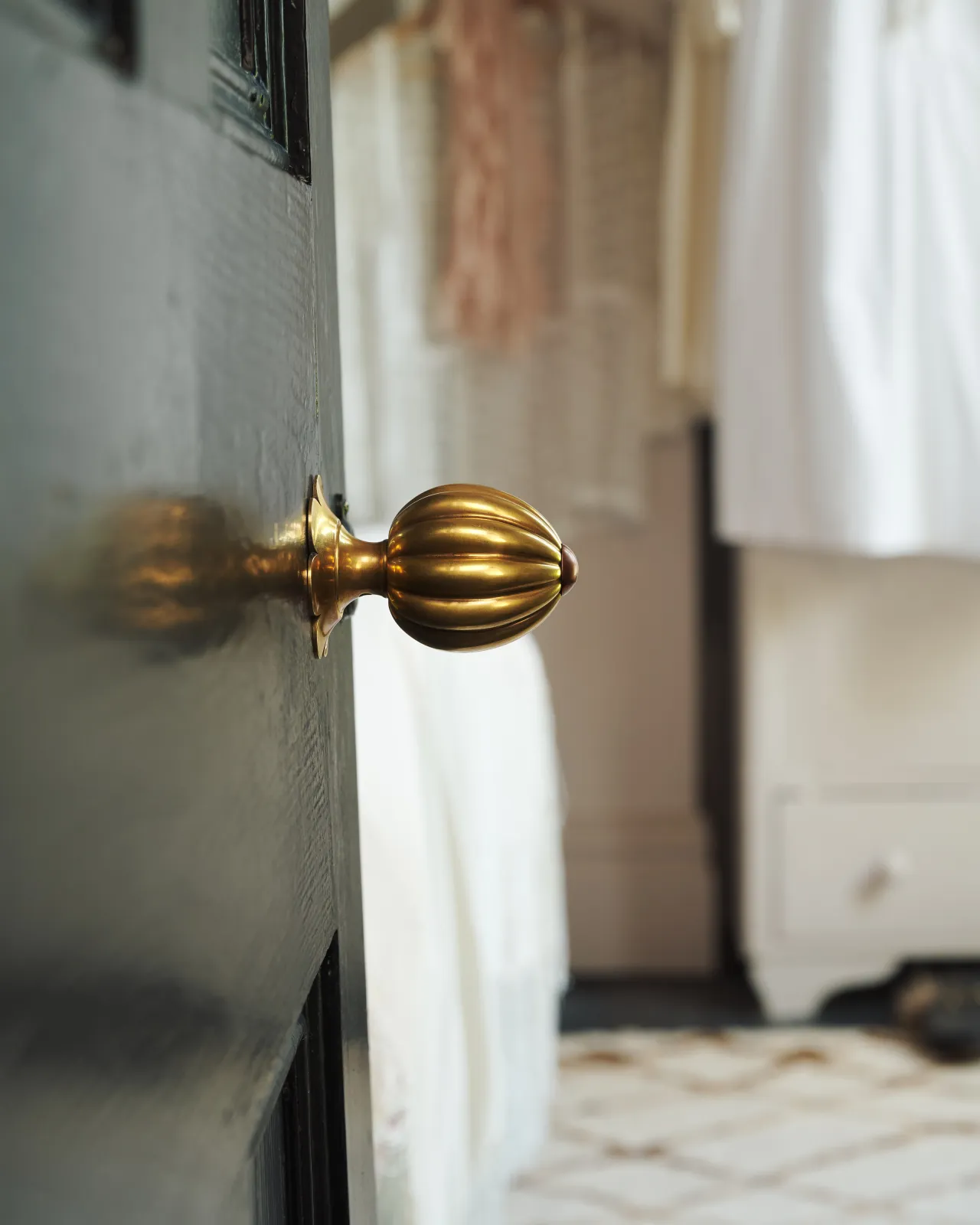 Marguerite Doorknob on a black door.