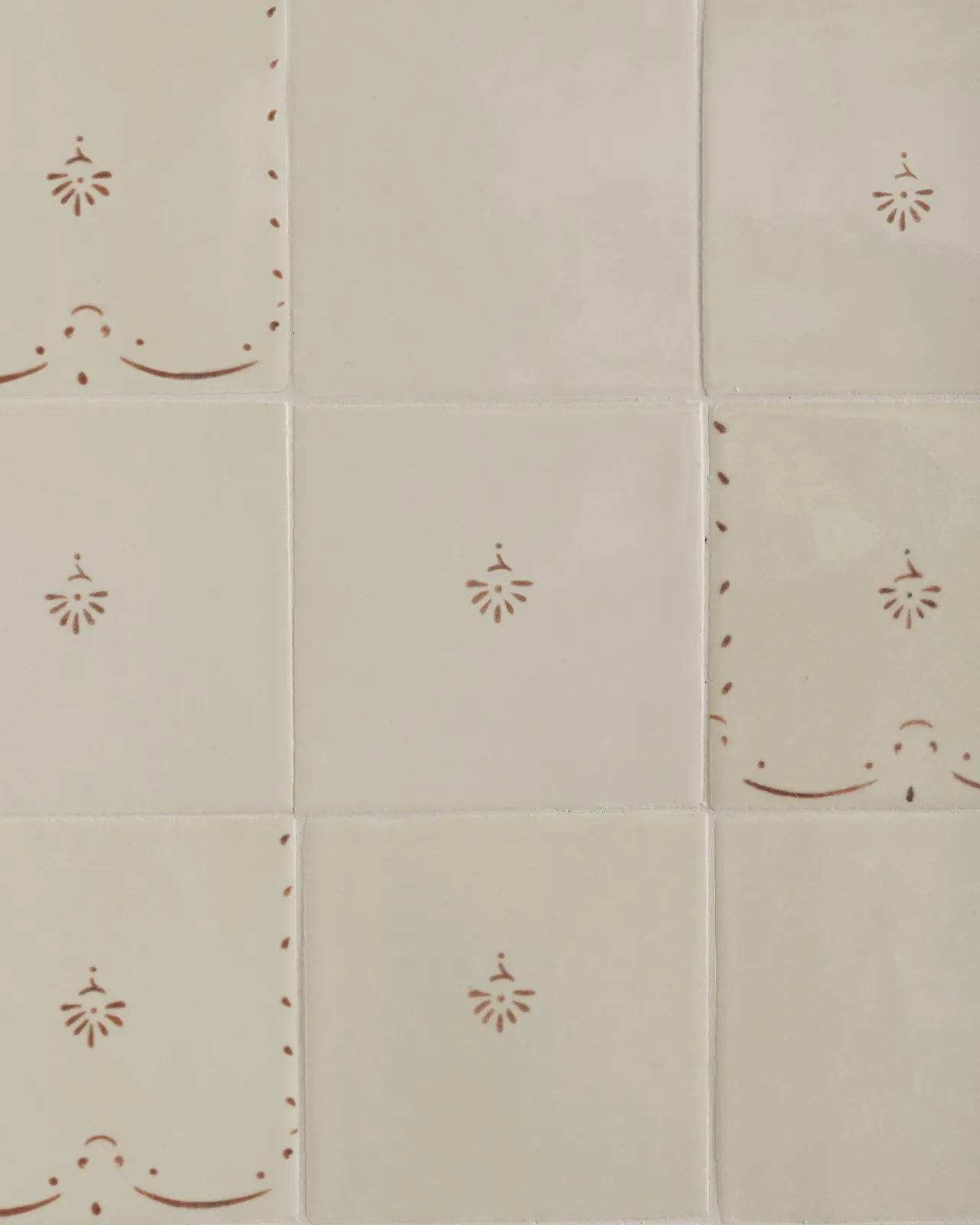a flatlay pattern of the ditsy delft tiles in sepia, with the ditsy tile in the middle
