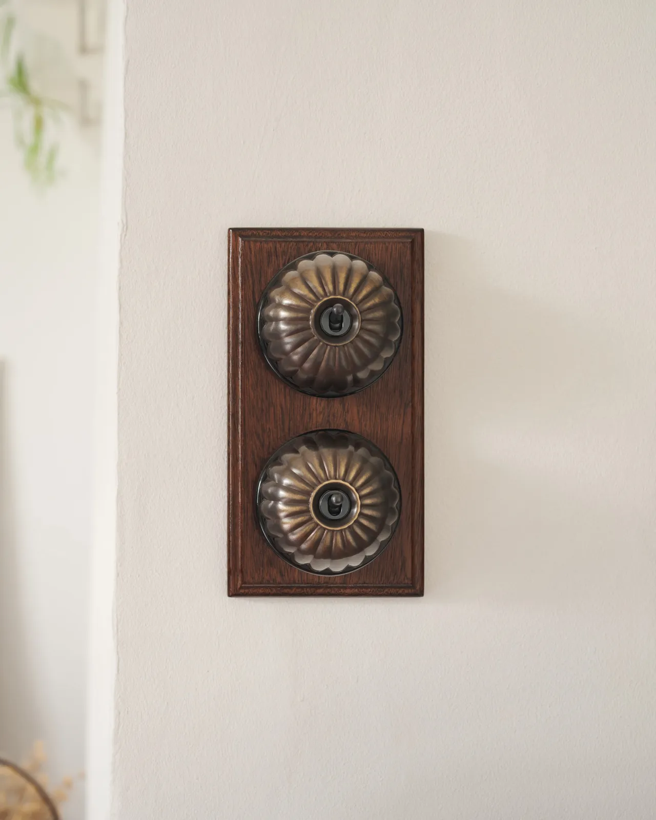 A pair of deVOL Jelly Toggle Switches in our 'Oxidised Brass' finish and fitted to a richly stained Sapele pattress.