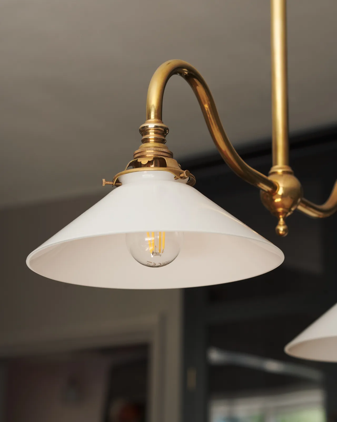 A small milk glass light shade seen from below.