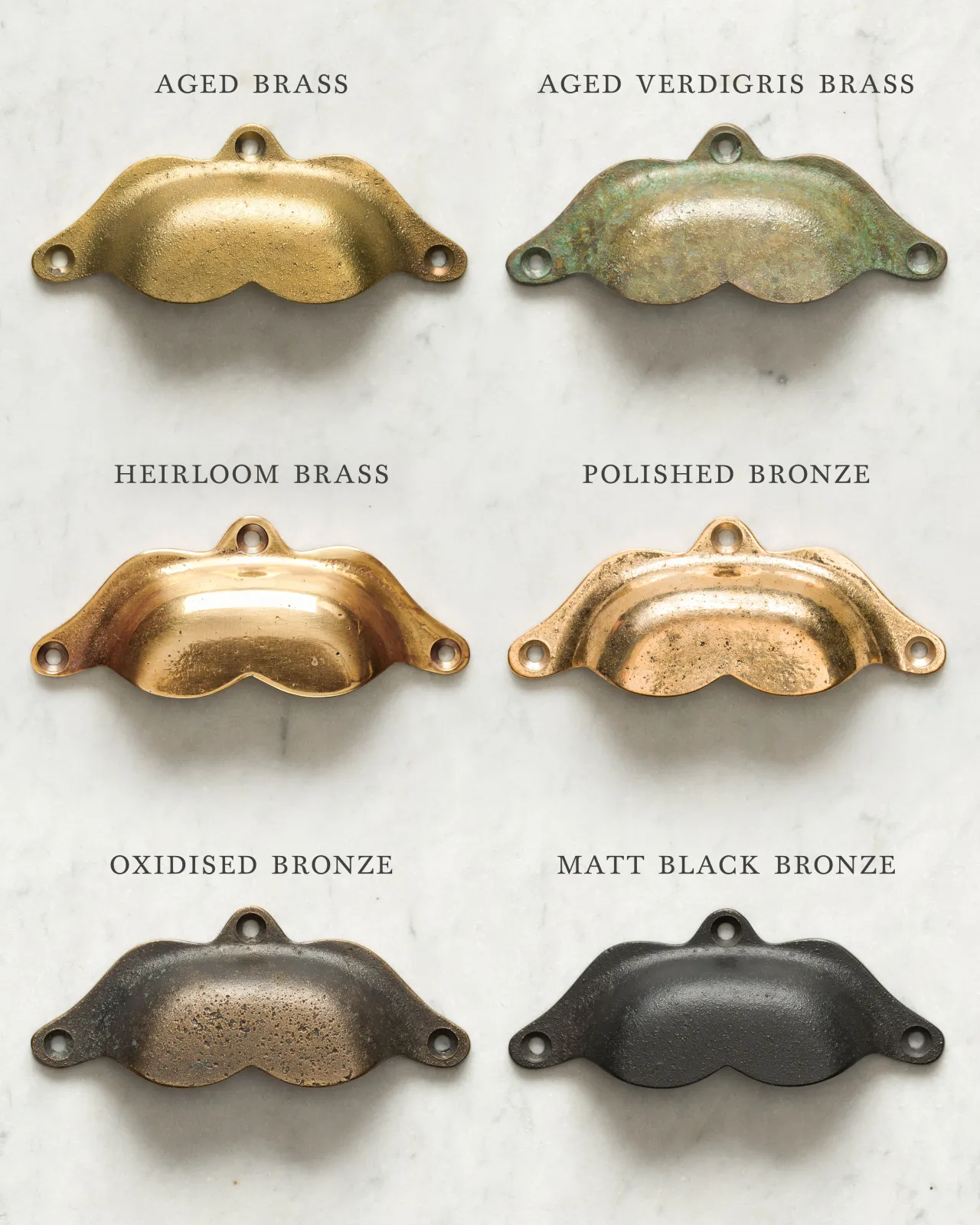 A collection of six bohemian-style cup handles for a kitchen cupboard or drawer with a variety of finishes, including 'Aged Brass', 'Aged Verdigris Brass', 'Heirloom Brass', 'Polished Bronze', 'Oxidised Bronze' and 'Matt Black Bronze'.