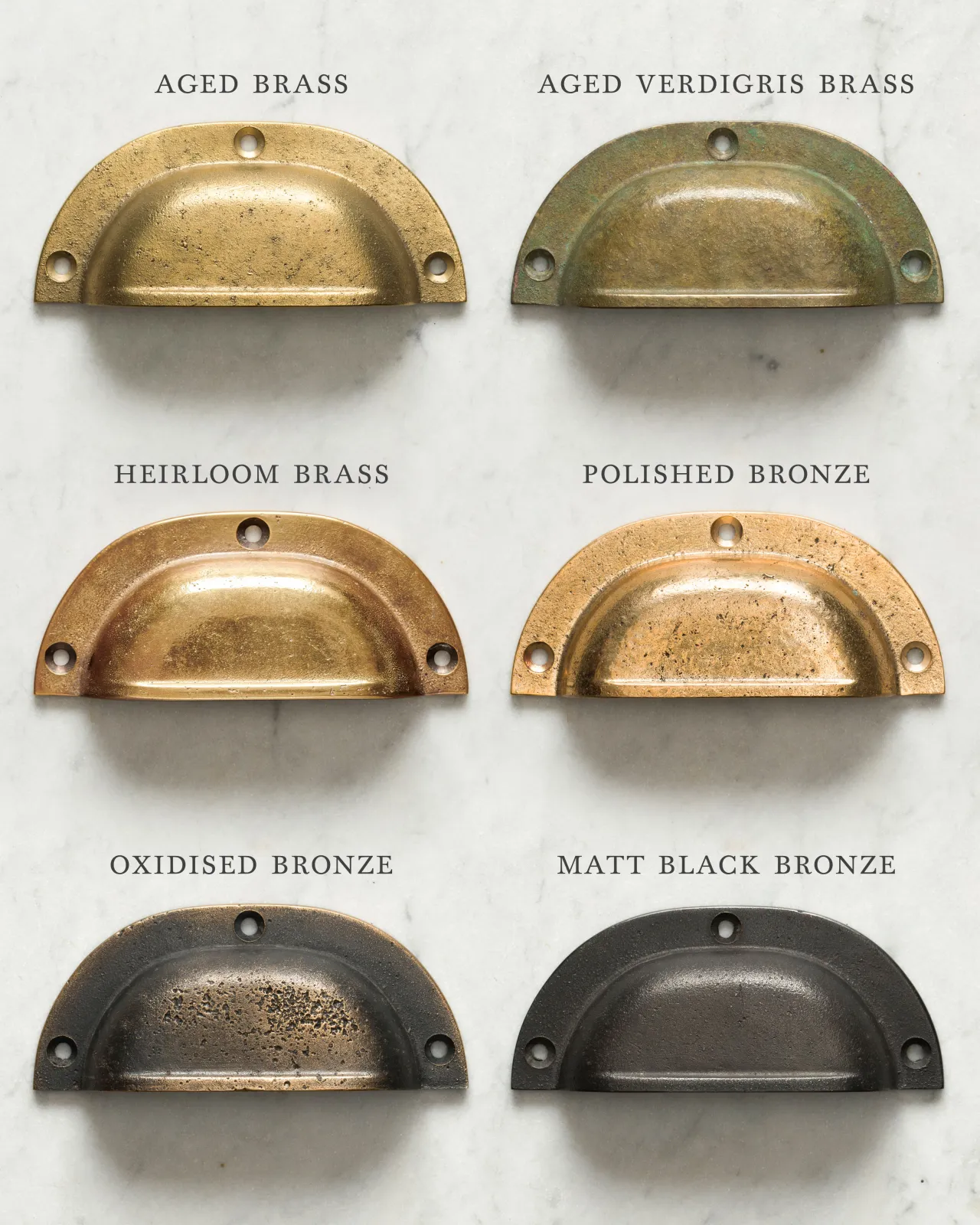 A collection of six classic cup handles for a kitchen cupboard or drawer with a variety of finishes, including 'Aged Brass', 'Aged Verdigris Brass', 'Heirloom Brass', 'Polished Bronze', 'Oxidised Bronze' and 'Matt Black Bronze'.