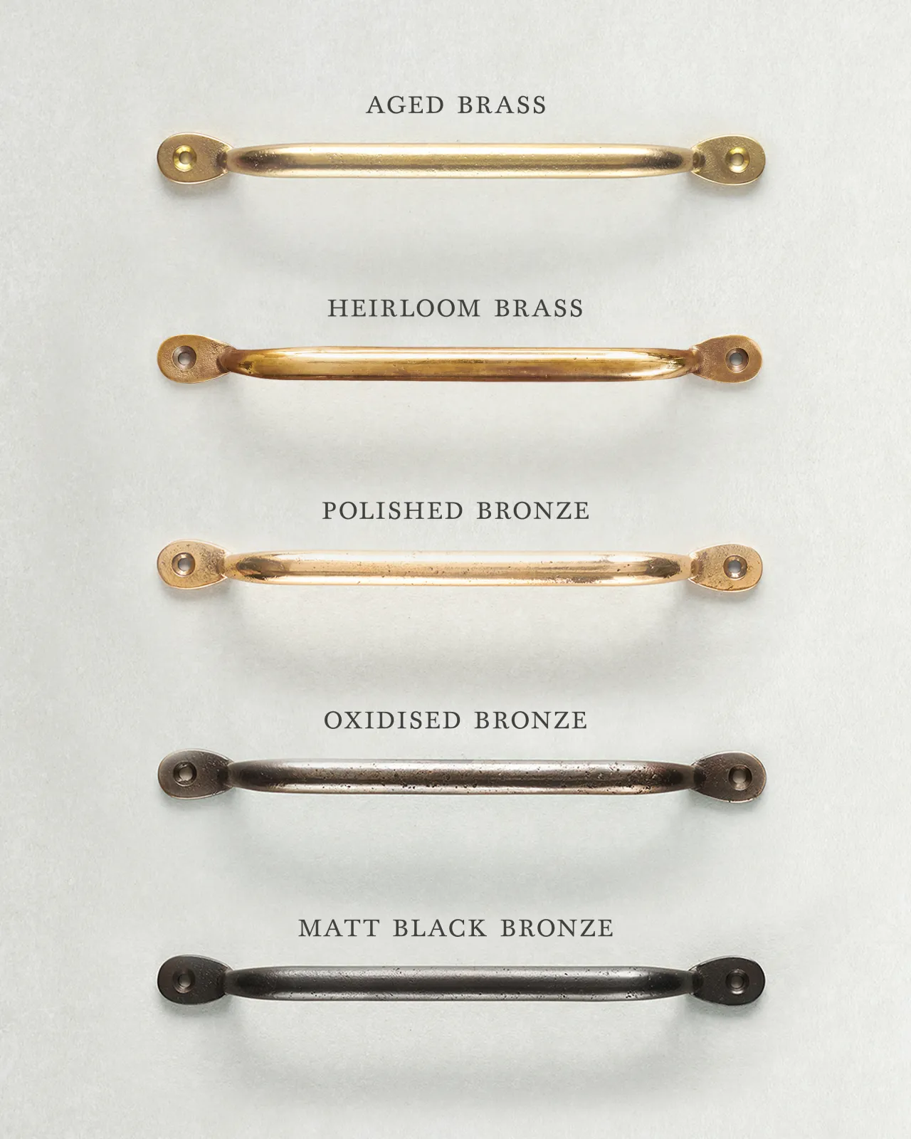 A collection of five classic pull handles for a kitchen cupboard or drawer with a variety of finishes, including 'Aged Brass', 'Heirloom Brass', 'Polished Bronze', 'Oxidised Bronze' and 'Matt Black Bronze'.