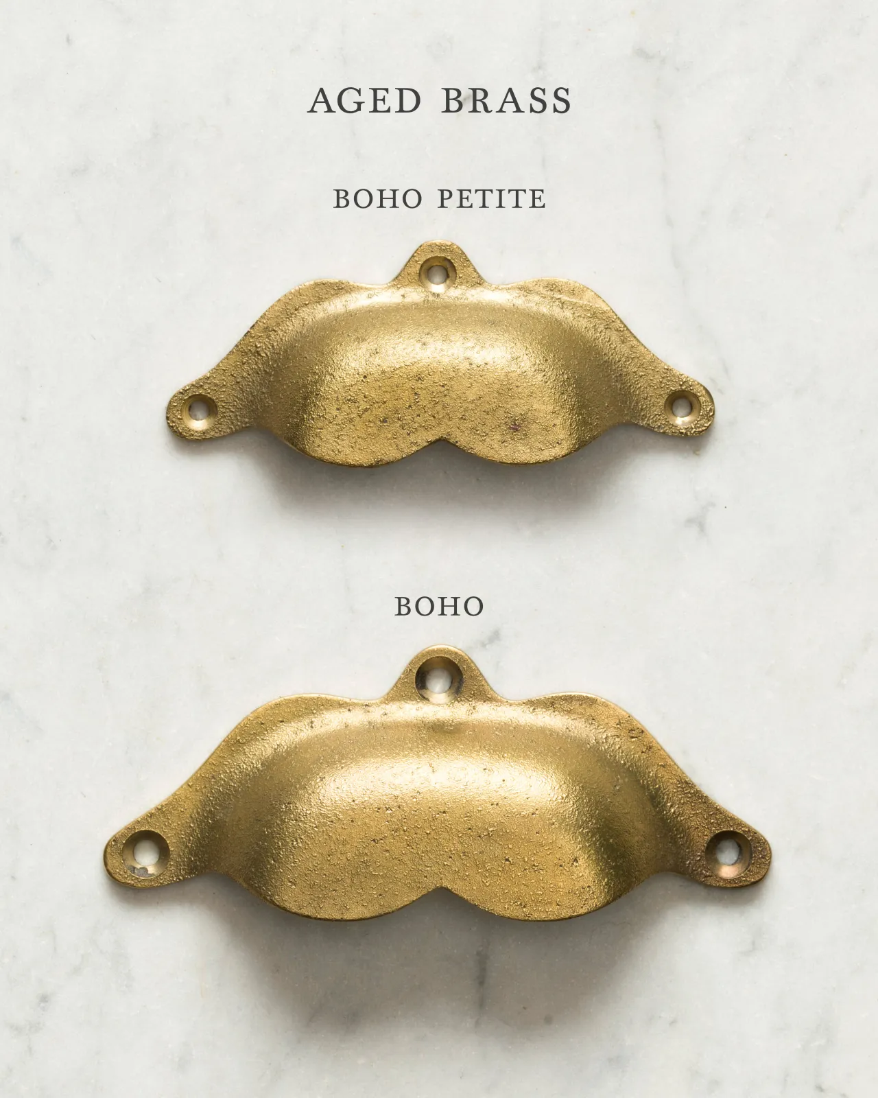Two bohemian-style cup handles for a kitchen cupboard or drawer with an aged brass finish. There is a large and a small size.