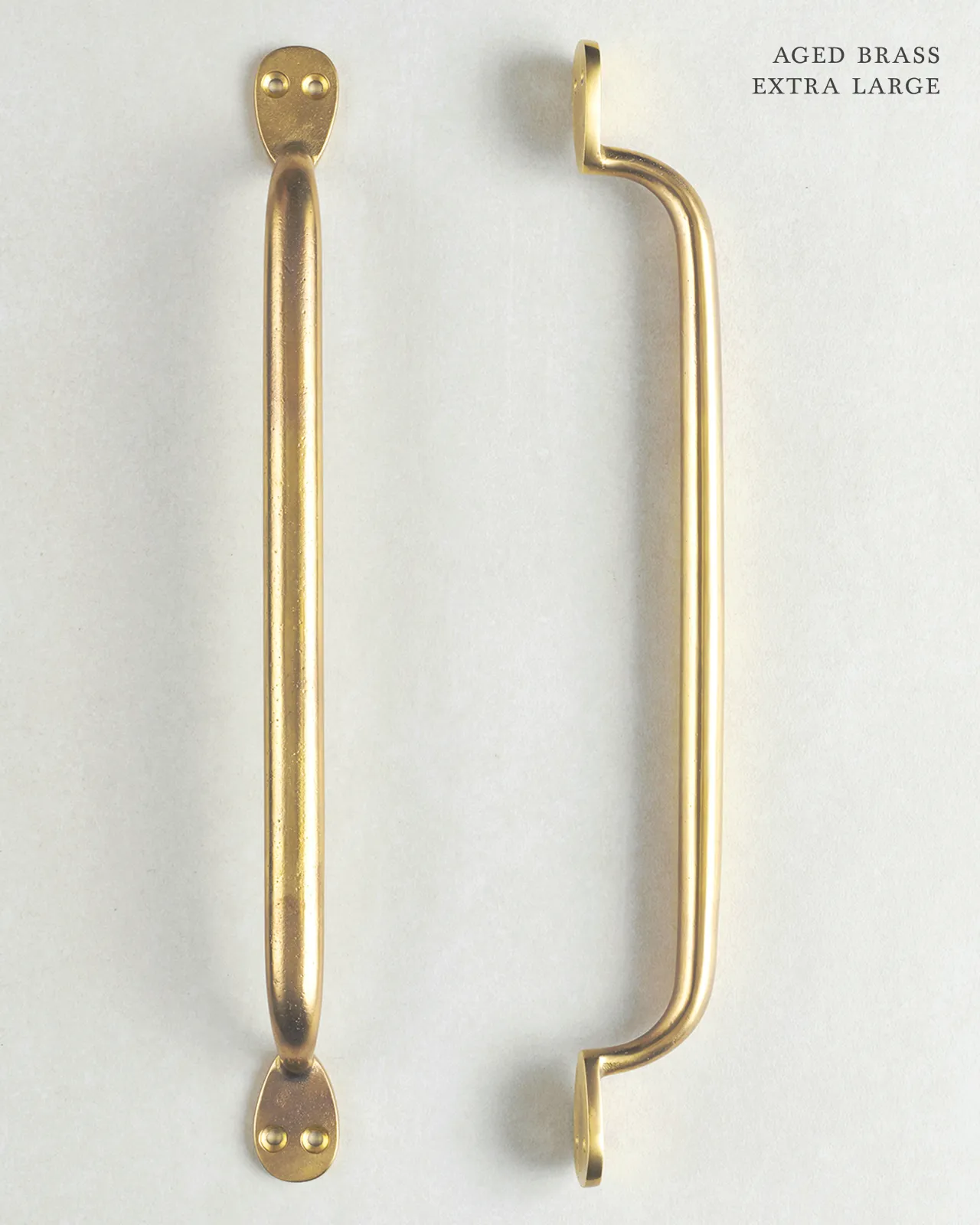 An ‘Extra Large’ classic pull handle for a kitchen cupboard or drawer with an aged brass finish.