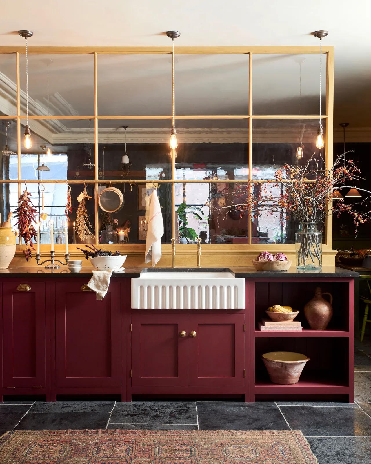 Looking towards a red-painted Shaker sink run in deVOL's New York showroom.