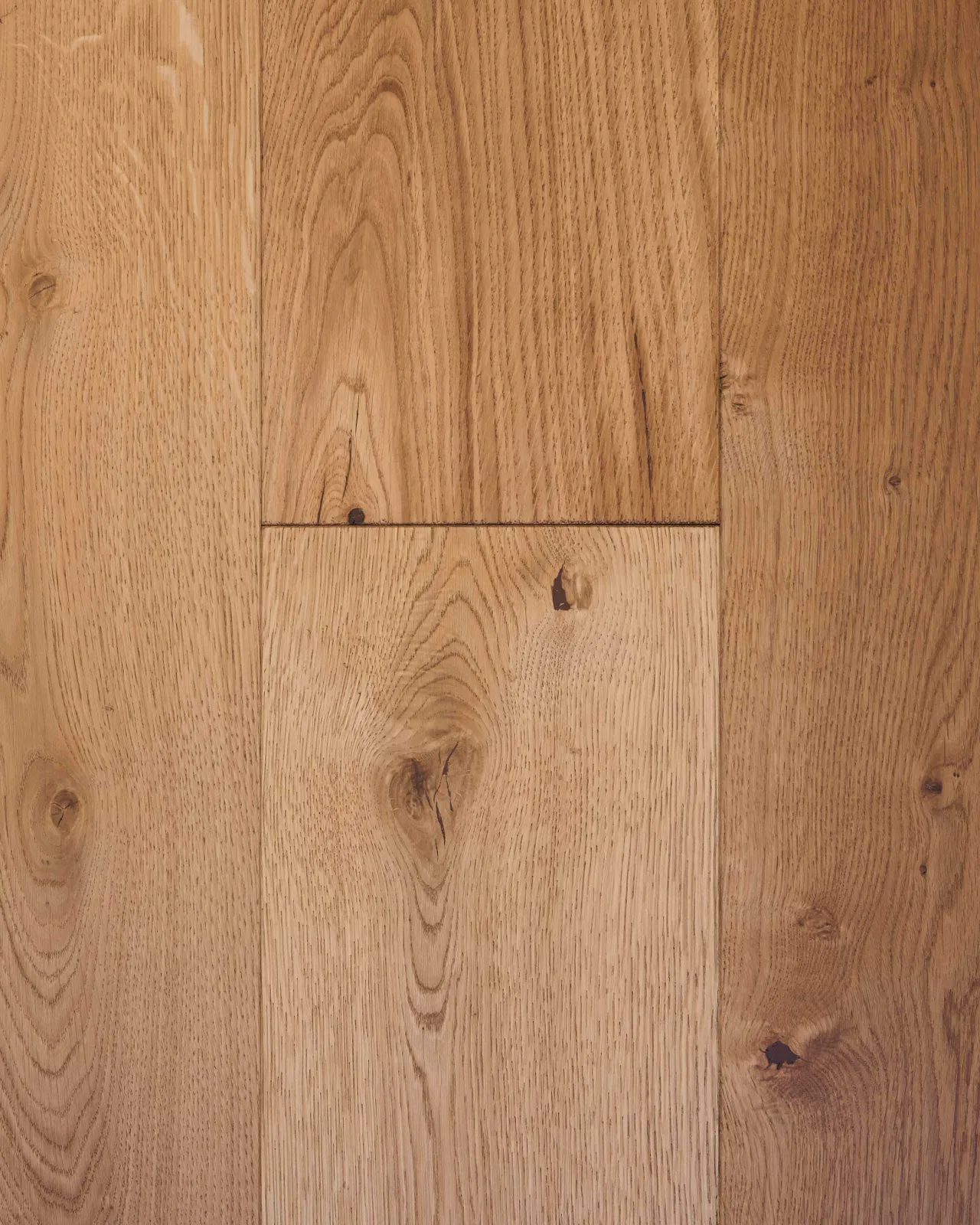 A close-up overhead view of oak floorboards with a clean oiled finish.