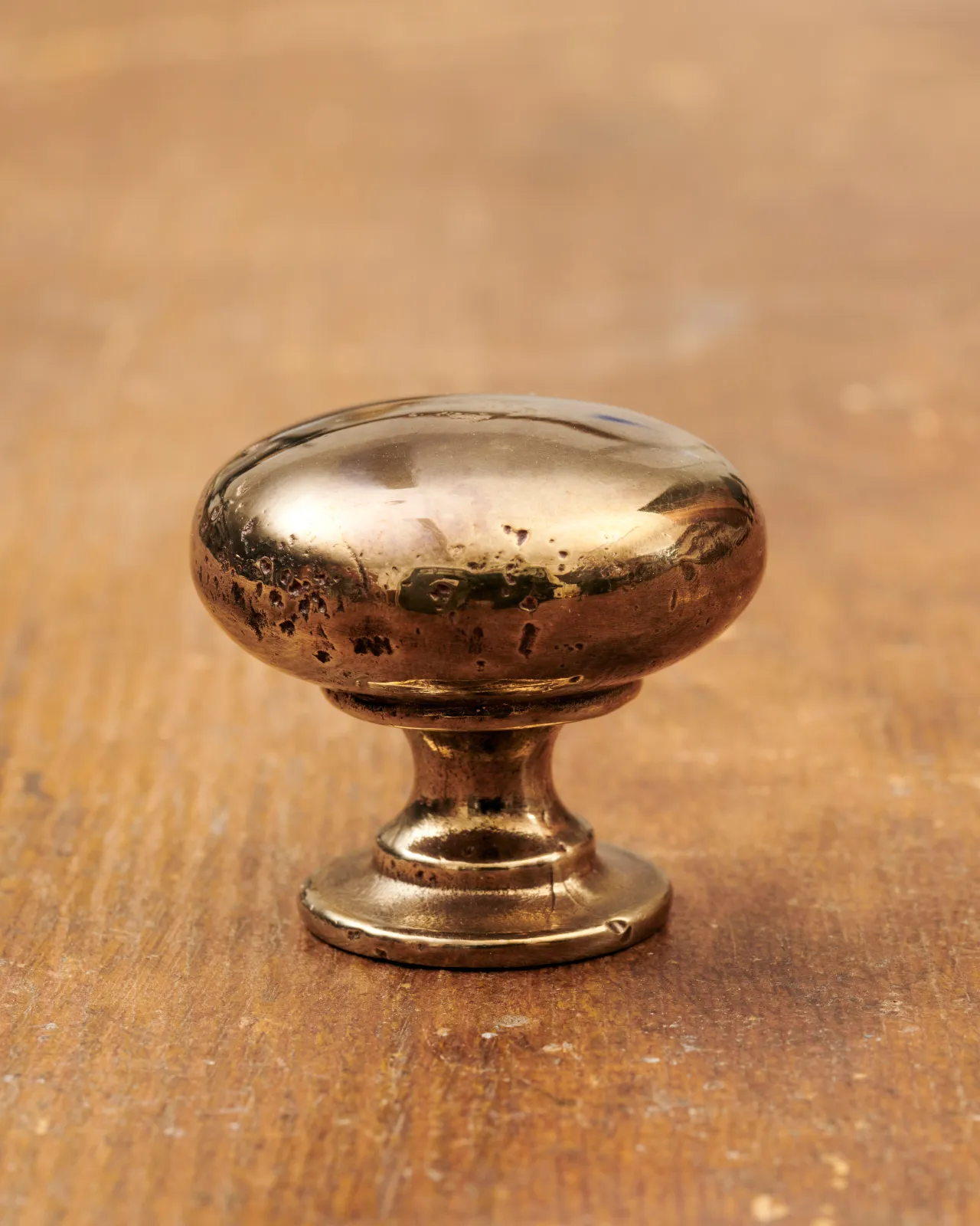 A ‘Large’ classic knob for a kitchen cupboard or drawer with a warm burnished brass finish.